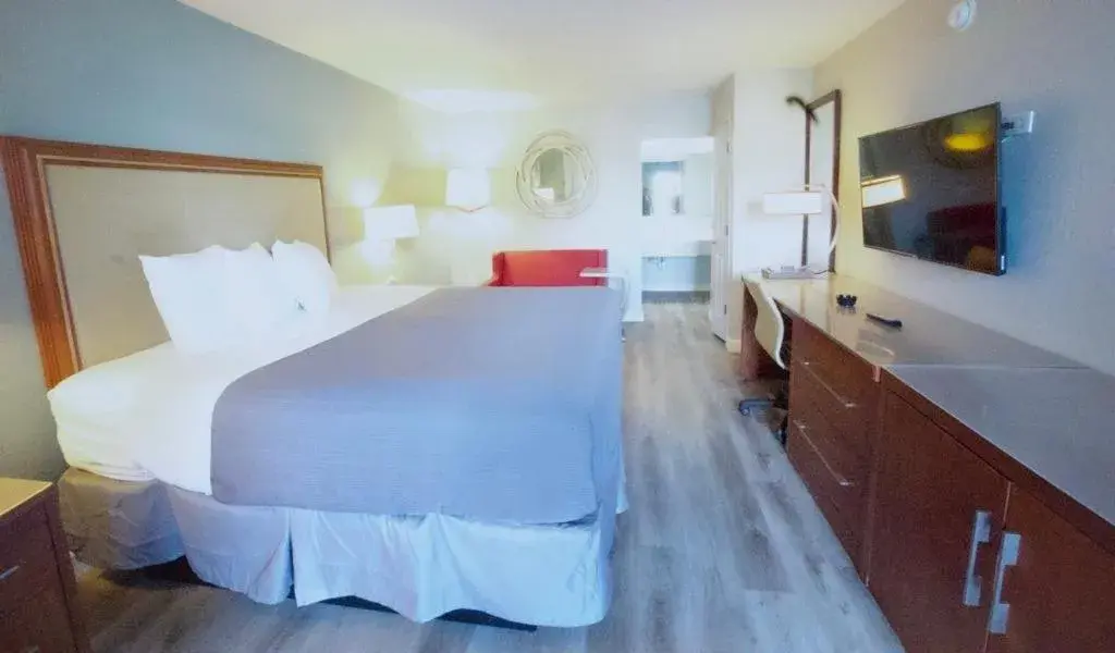 Bed in All Seasons Inn & Suites Bed in All Seasons Inn & Suites