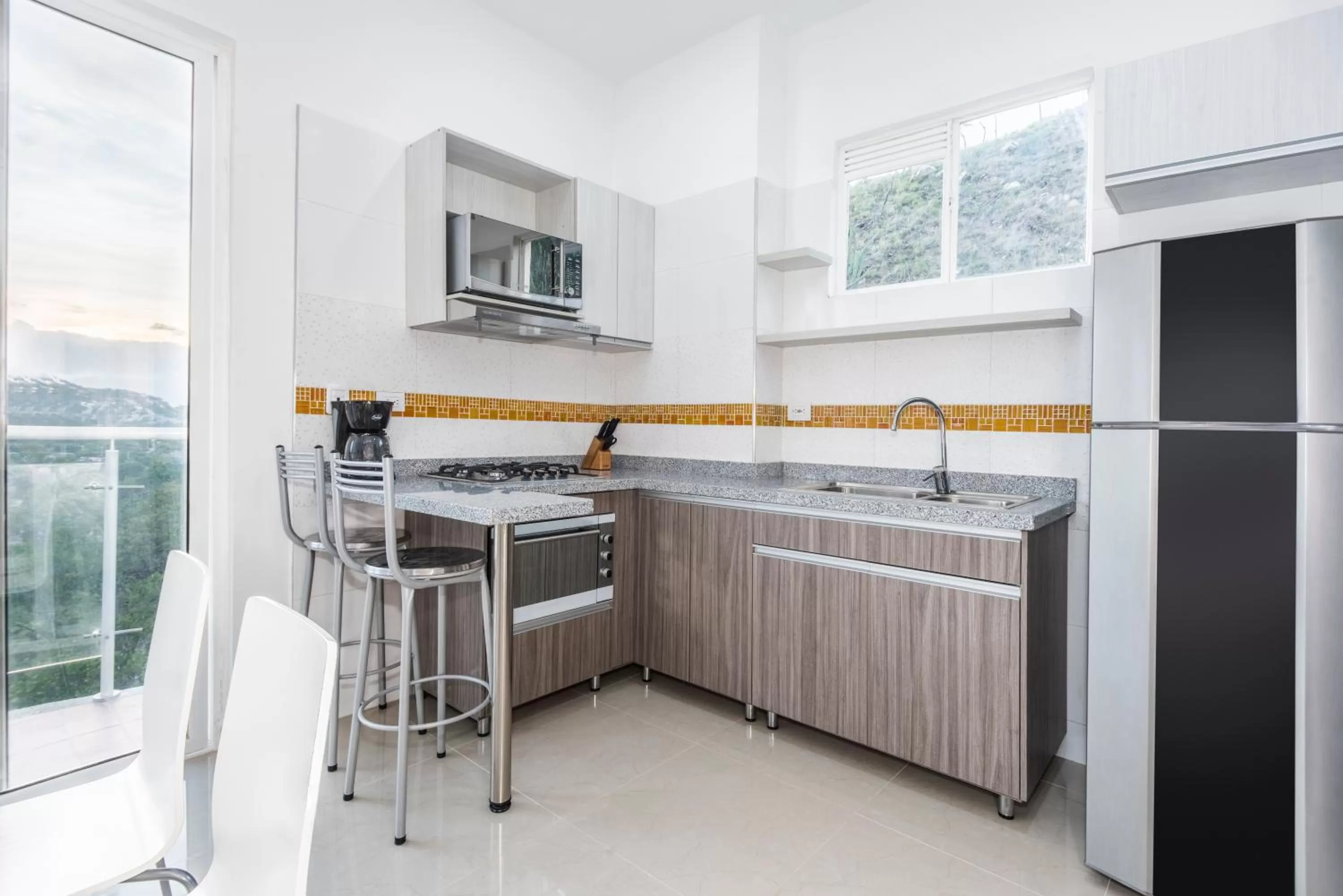 Kitchen or kitchenette in Terrazas Tayrona Travelers Apartamentos y Suites