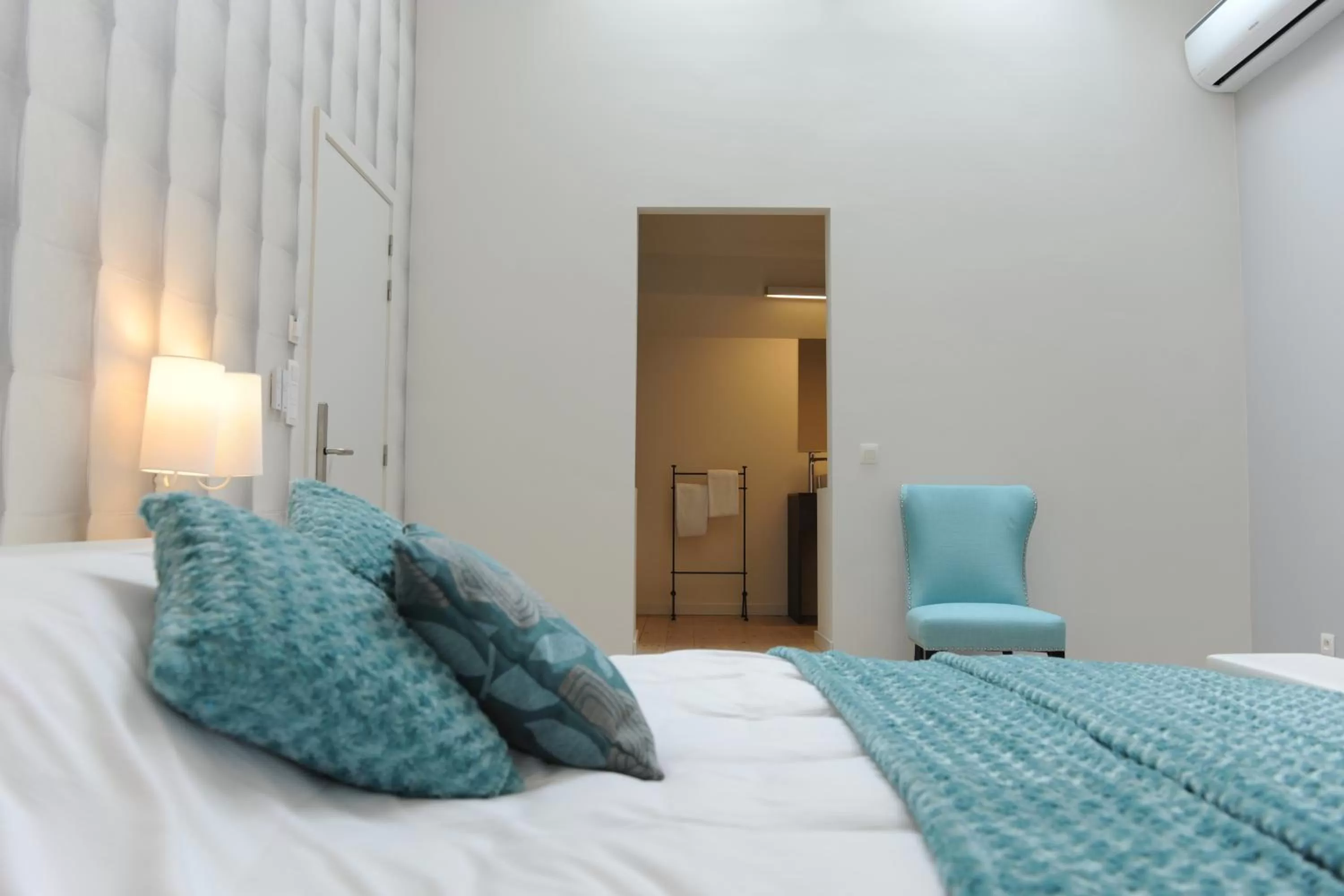 Bed in Charmehotel Villa Saporis