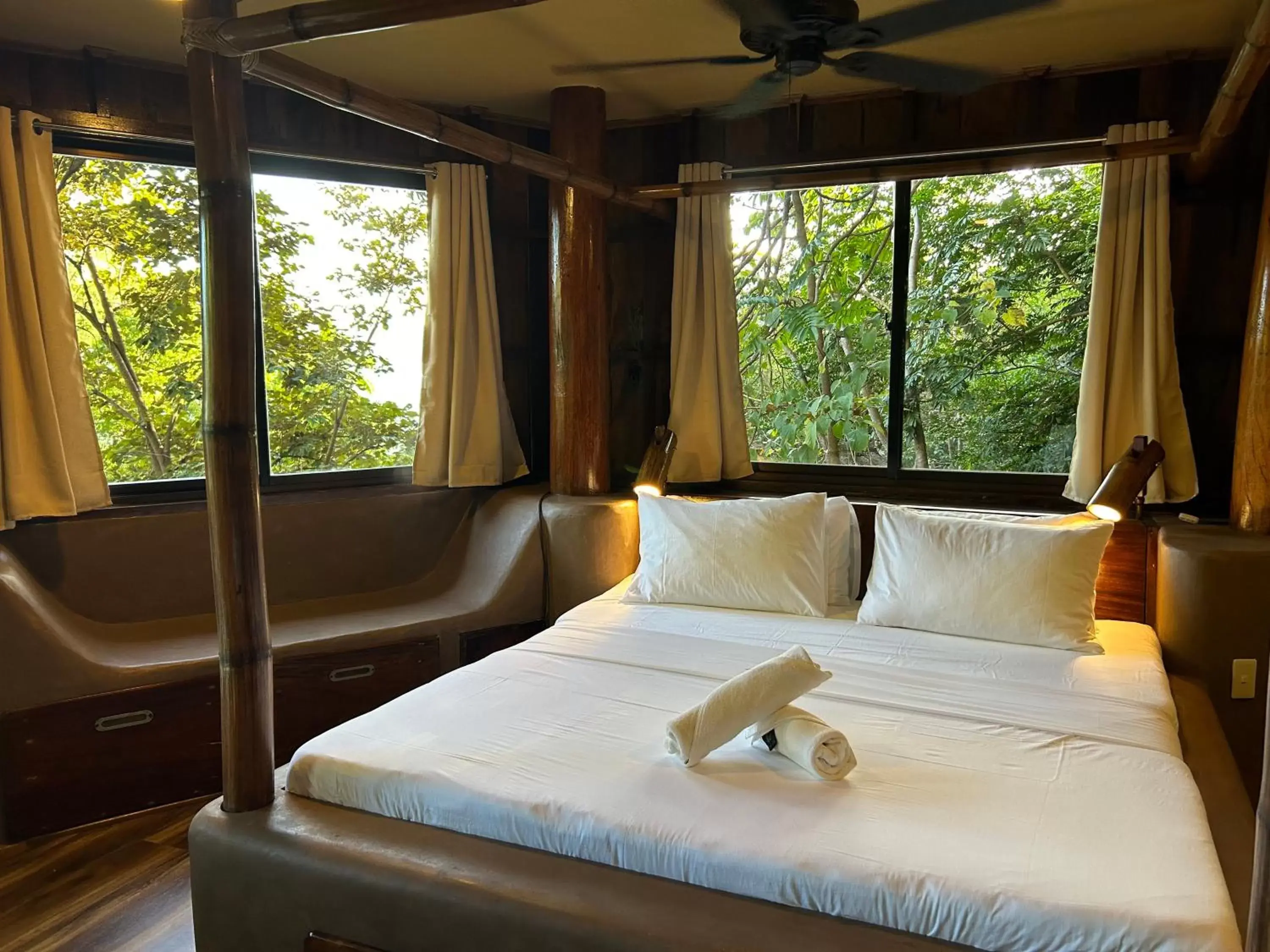 Bed in Sangat Island Dive Resort