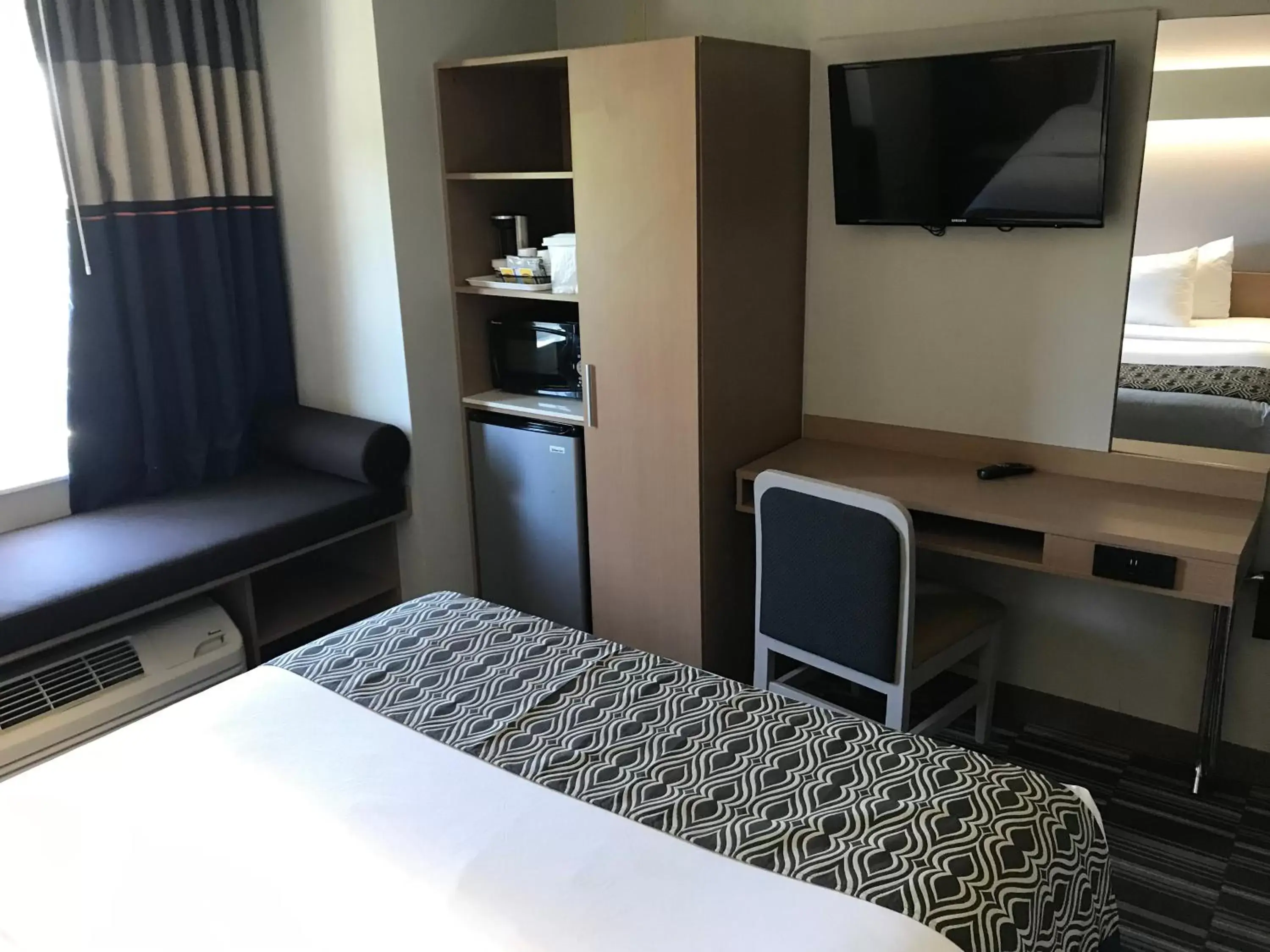 Bedroom, TV/Entertainment Center in Microtel Inn Suite by Wyndham BWI Airport