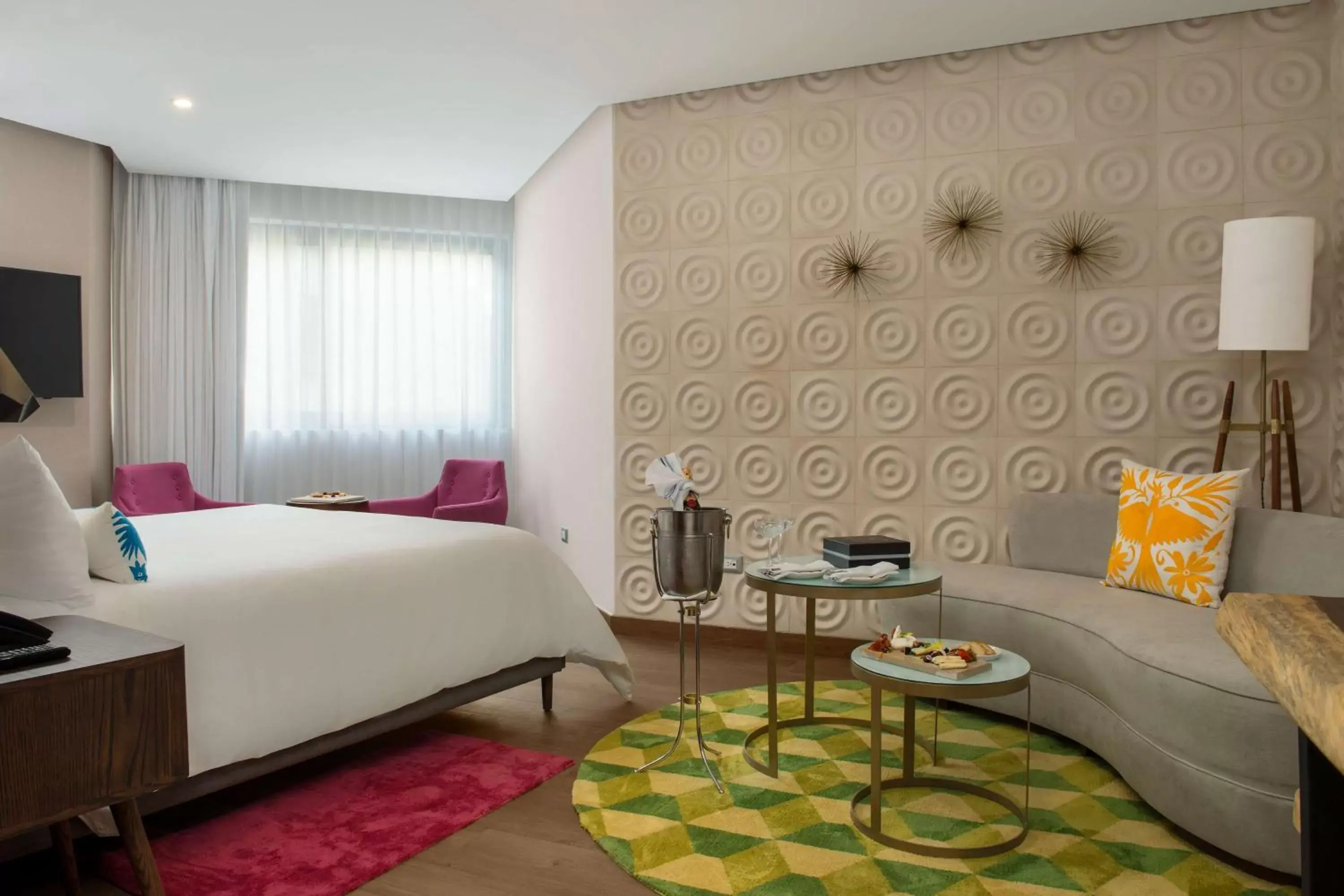 Living room, Bed in The Fives Downtown Hotel & Residences, Curio Collection by Hilton