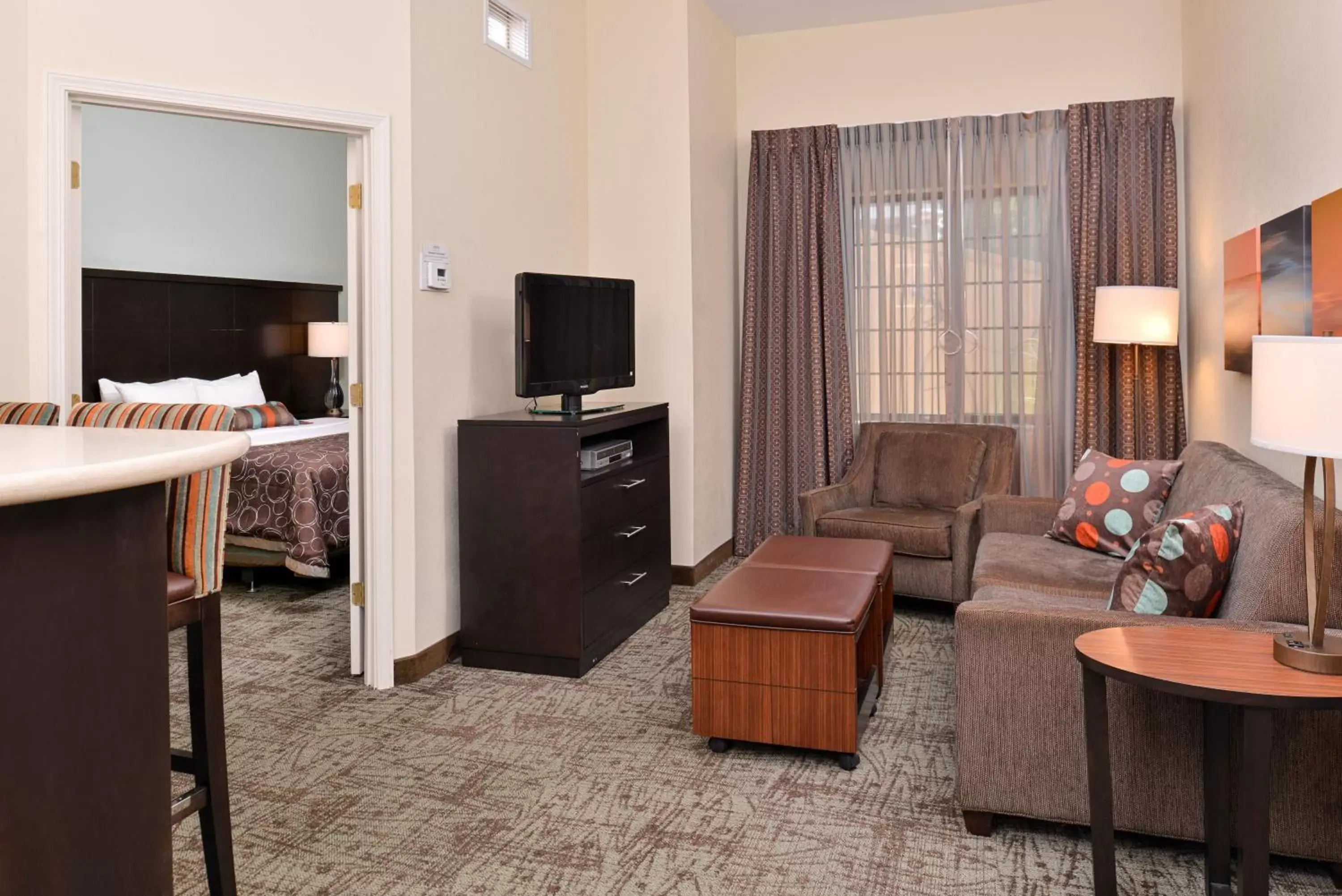 Photo of the whole room, TV/Entertainment Center in Staybridge Suites O'Fallon Chesterfield, an IHG Hotel