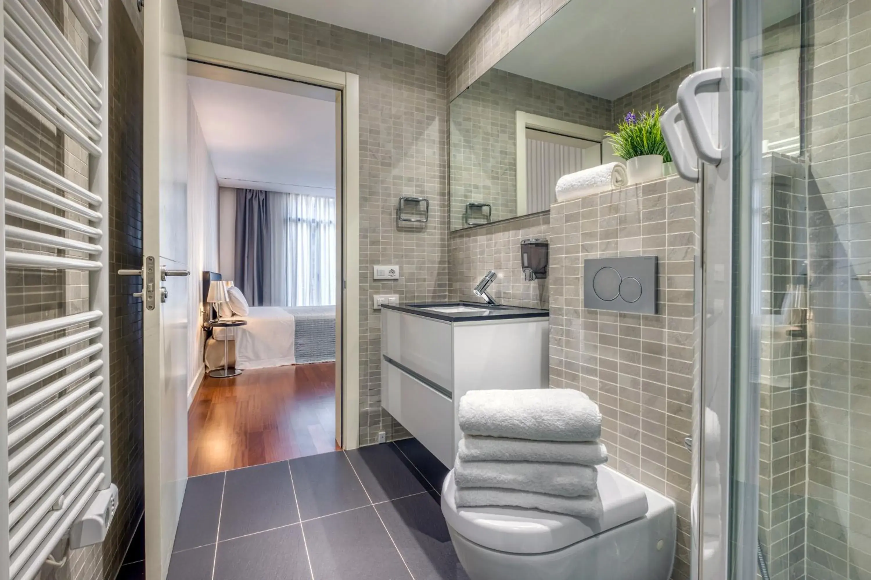 Shower, Bathroom in Paseo de Gracia Bas Apartments by Aspasios