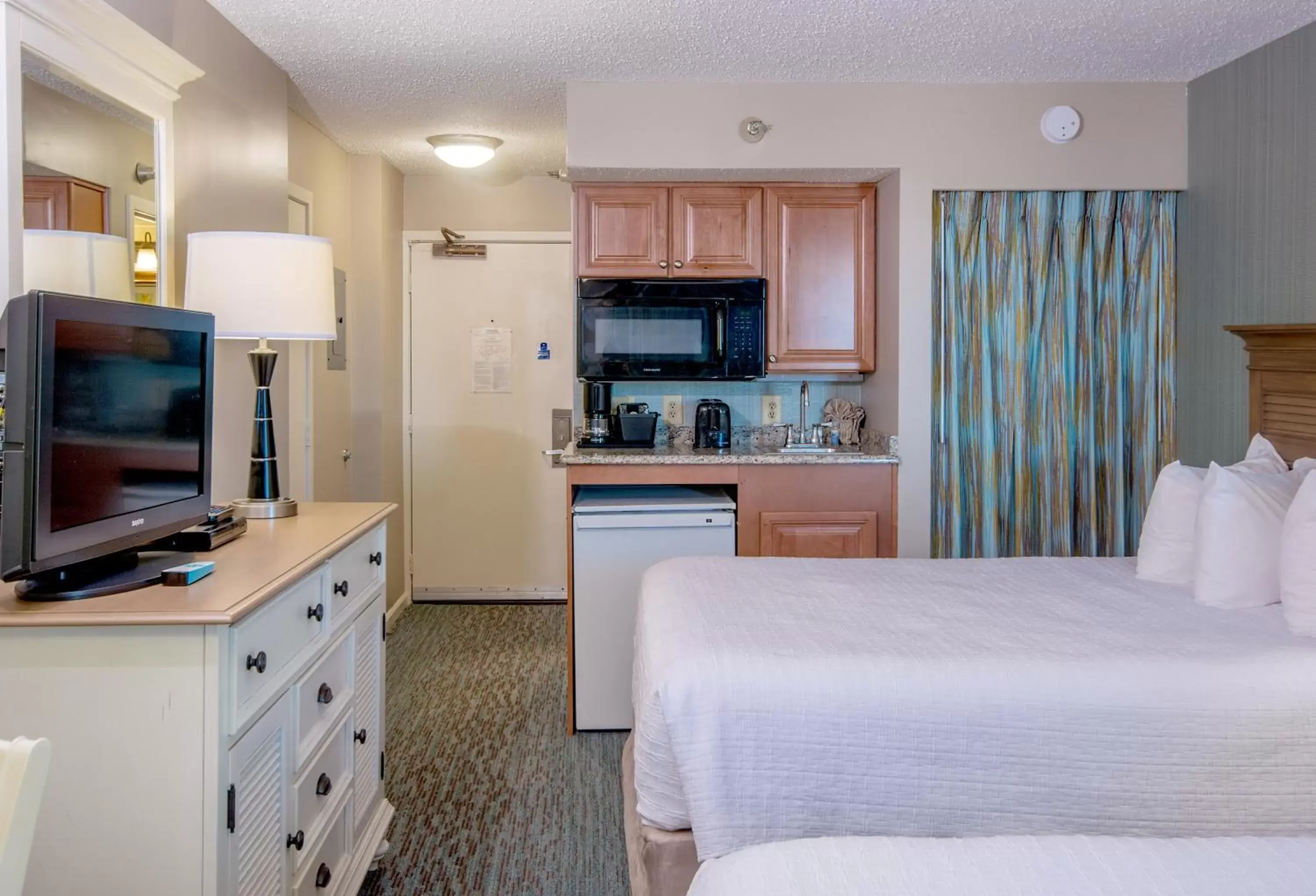 Photo of the whole room, TV/Entertainment Center in The Strand - A Boutique Resort