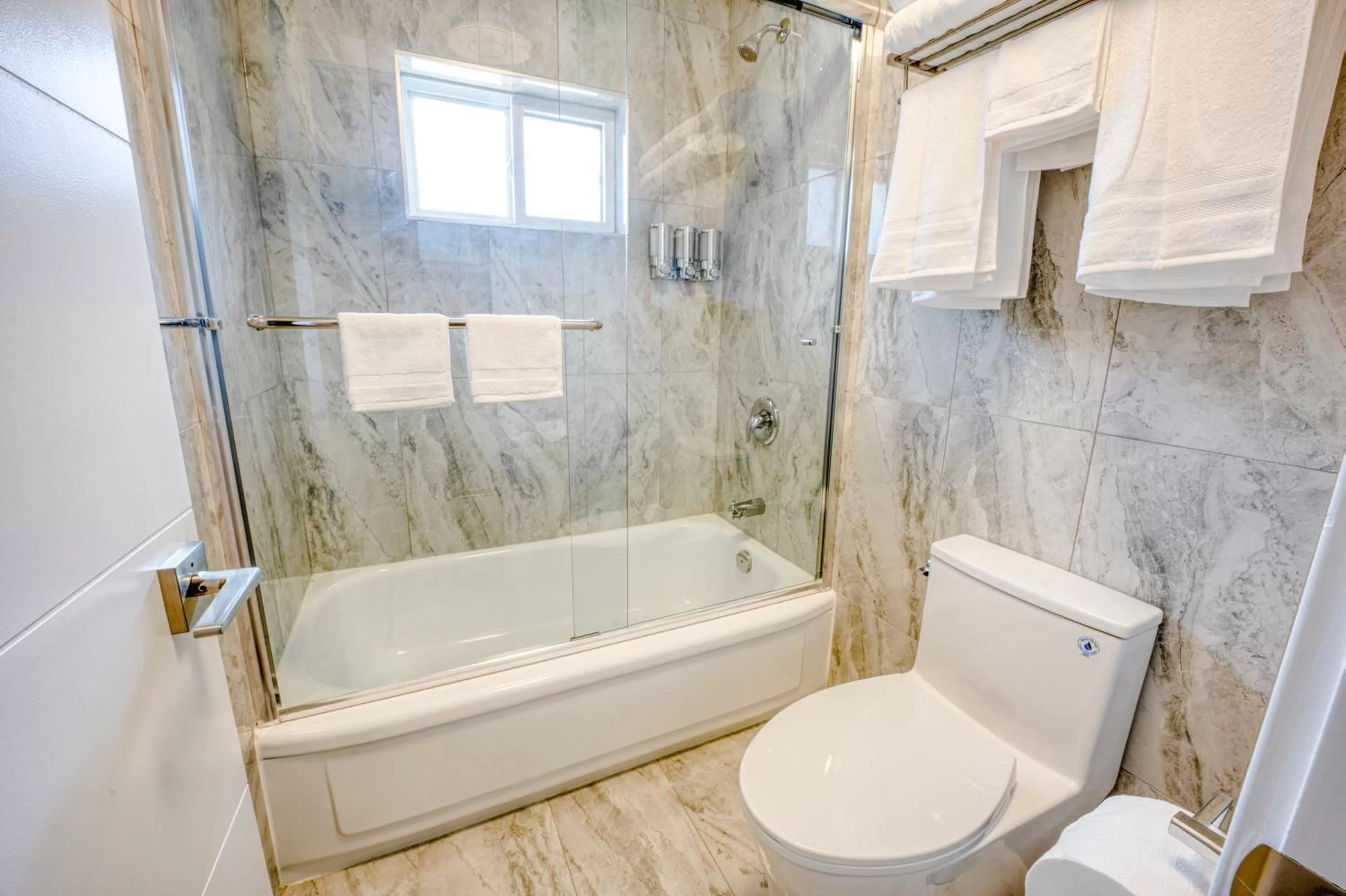 Toilet in Harrison Grand Motel