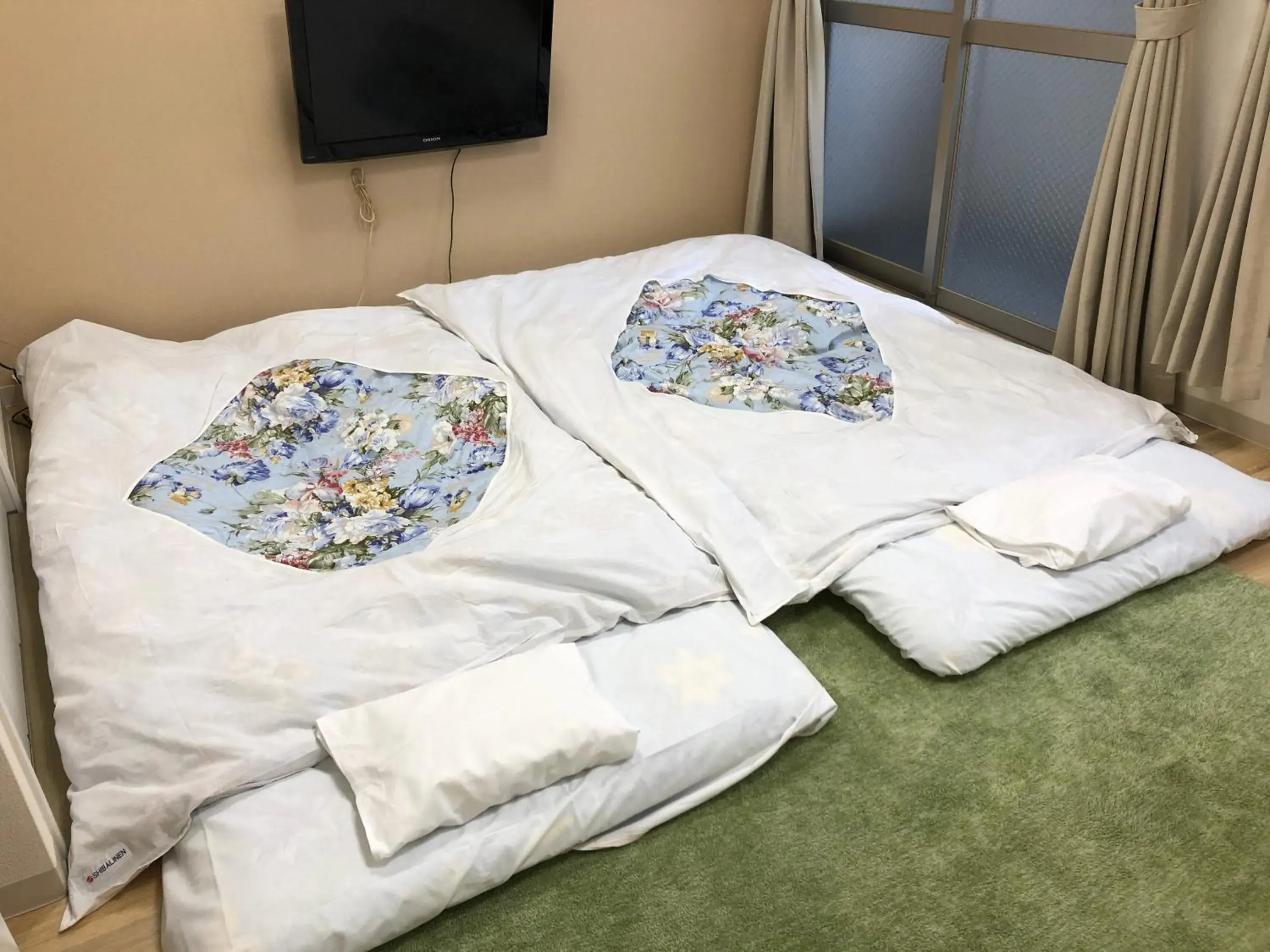 Bed in Hotel Mirai