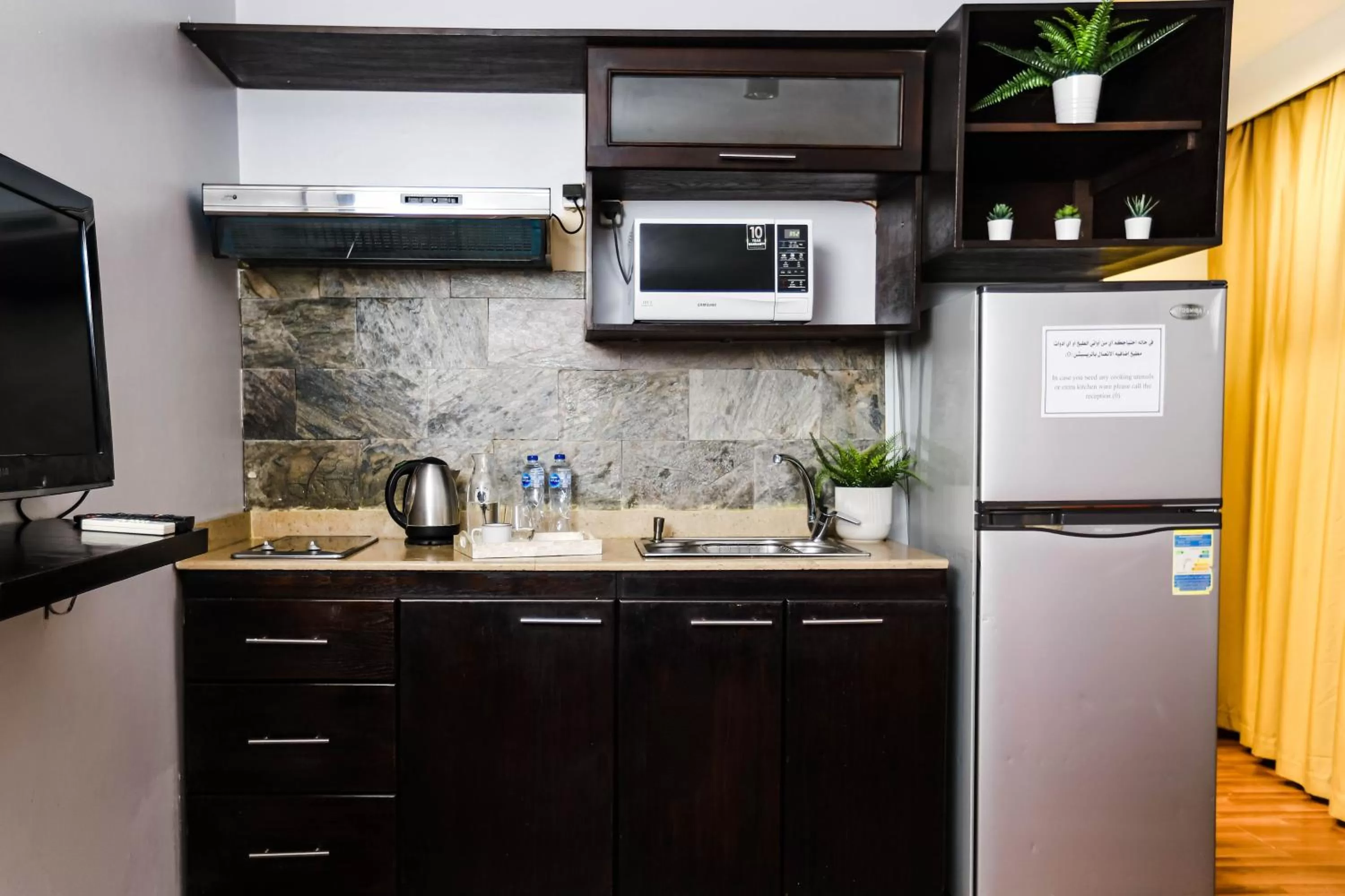 Kitchen or kitchenette in NewCity Hotel & Suites