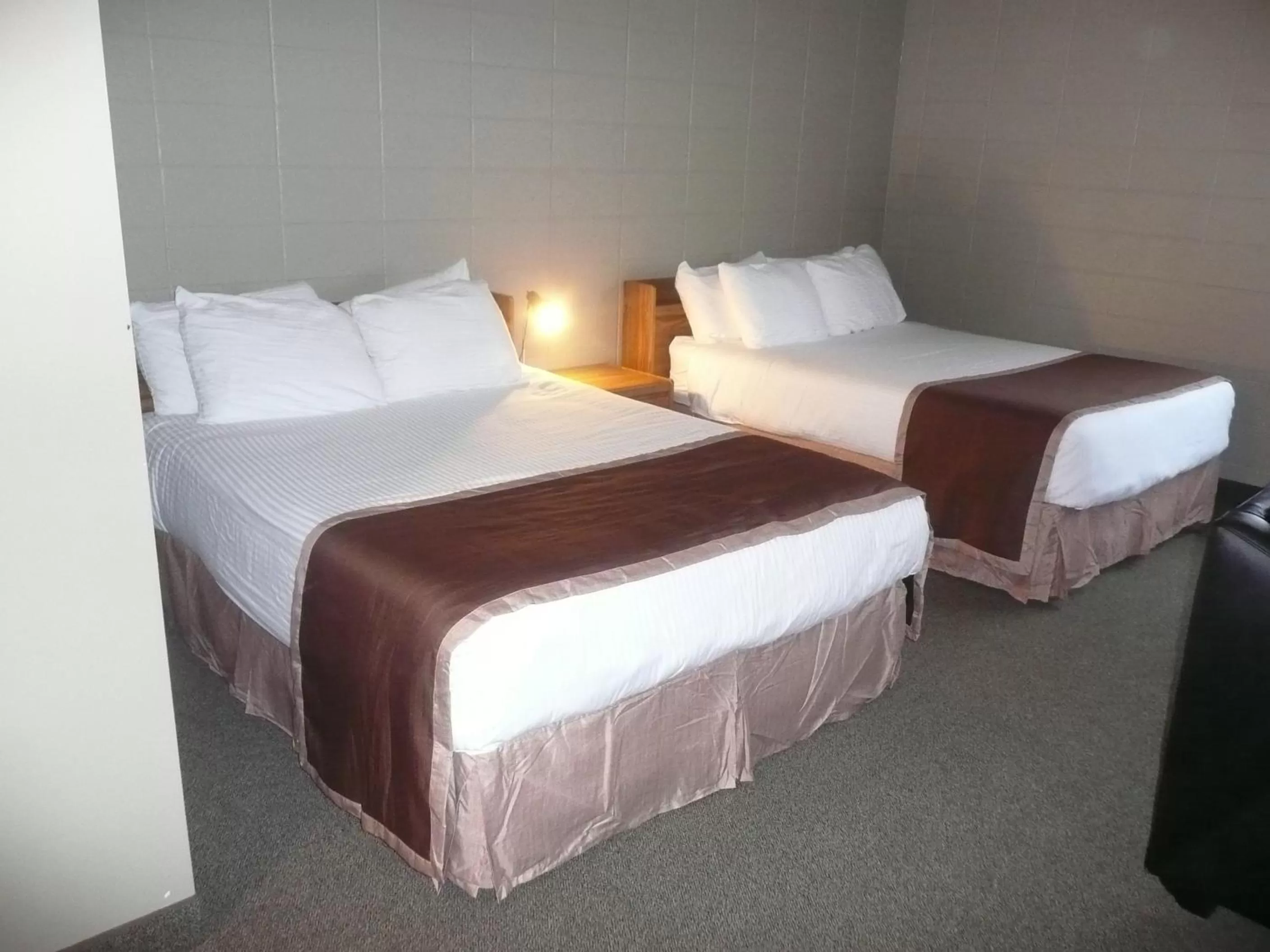 Bed in Sandstone Motel