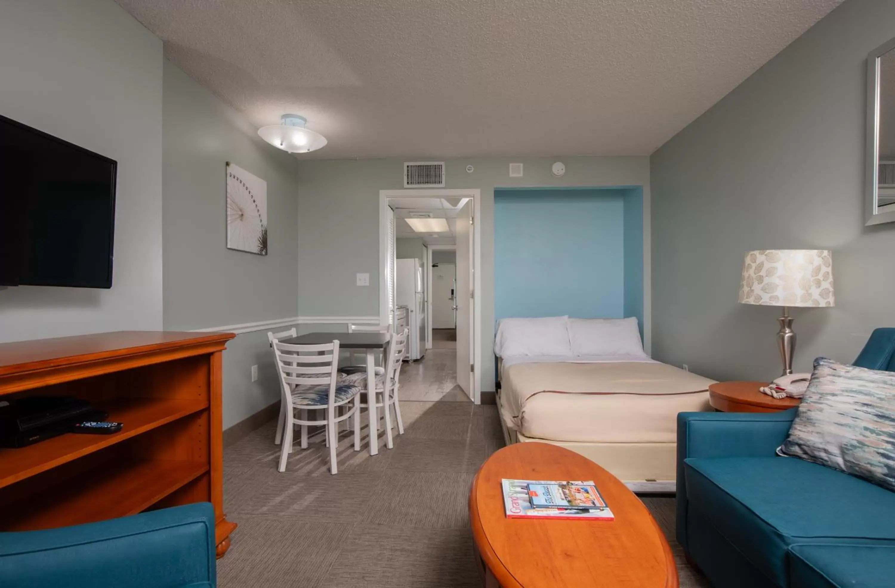 Bed, Seating Area in Grande Shores Ocean Resorts Condominiums