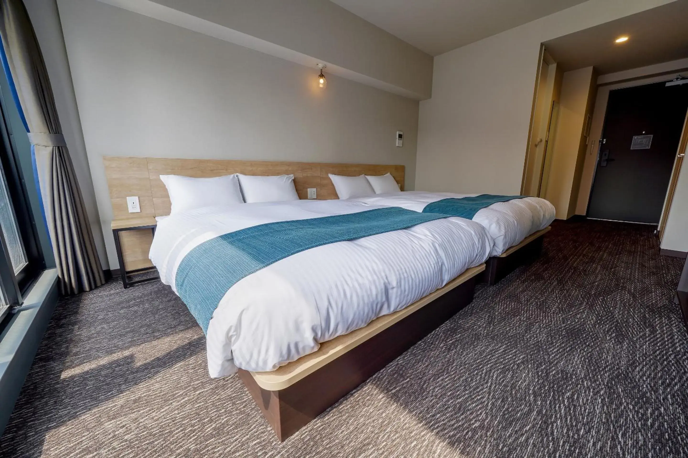 Bed in RESI STAY cotorune KYOTO