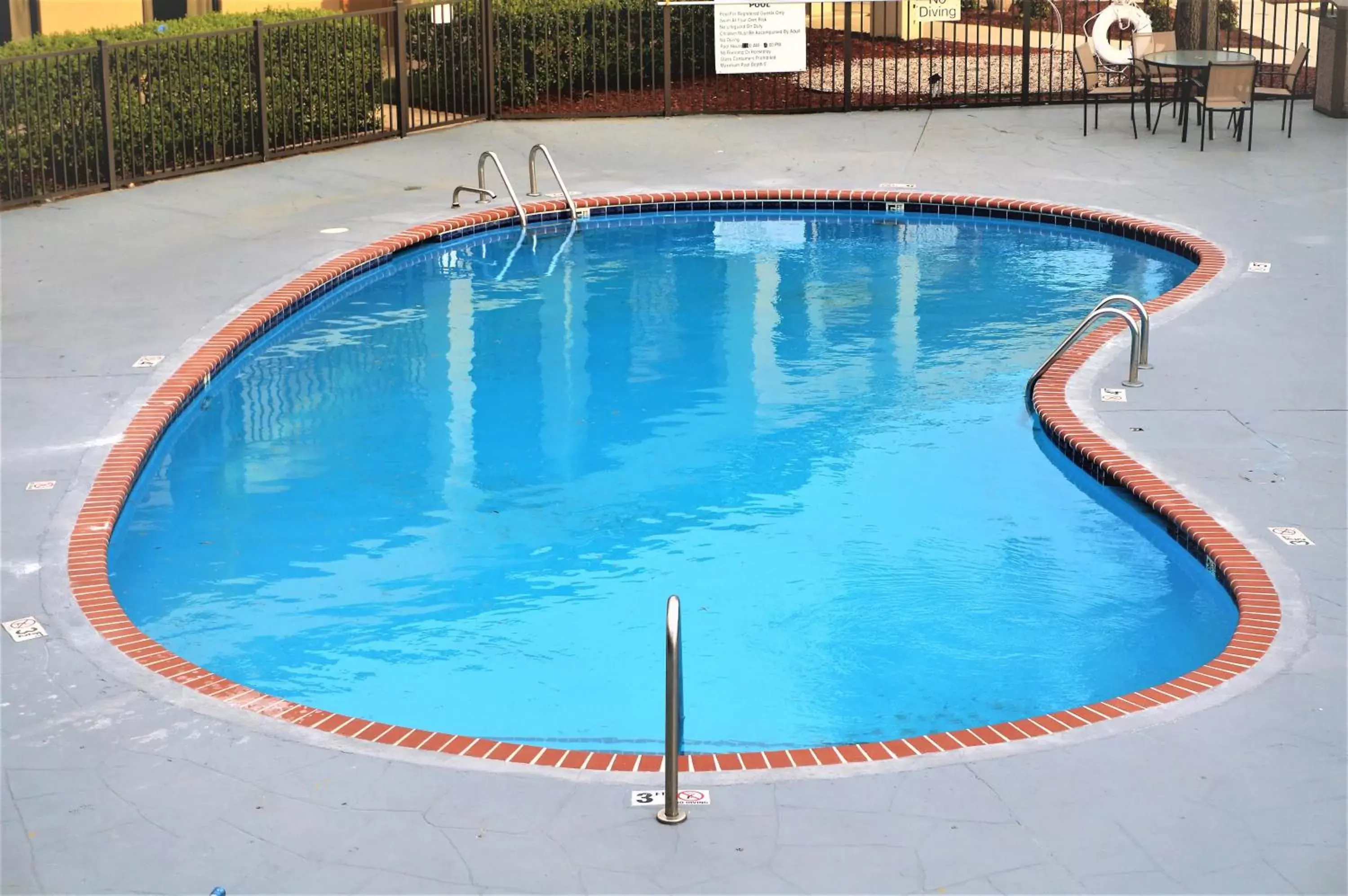 Swimming Pool in Howard Johnson by Wyndham Greensboro Near the Coliseum