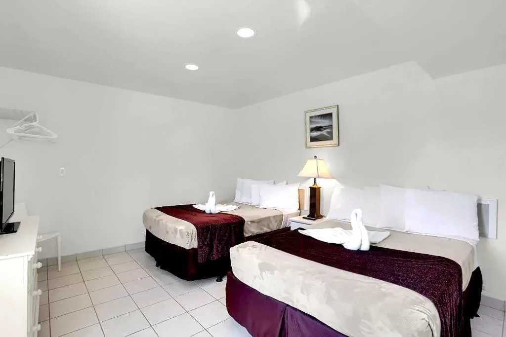 Bed in Heart of Wildwood Boardwalk Motel