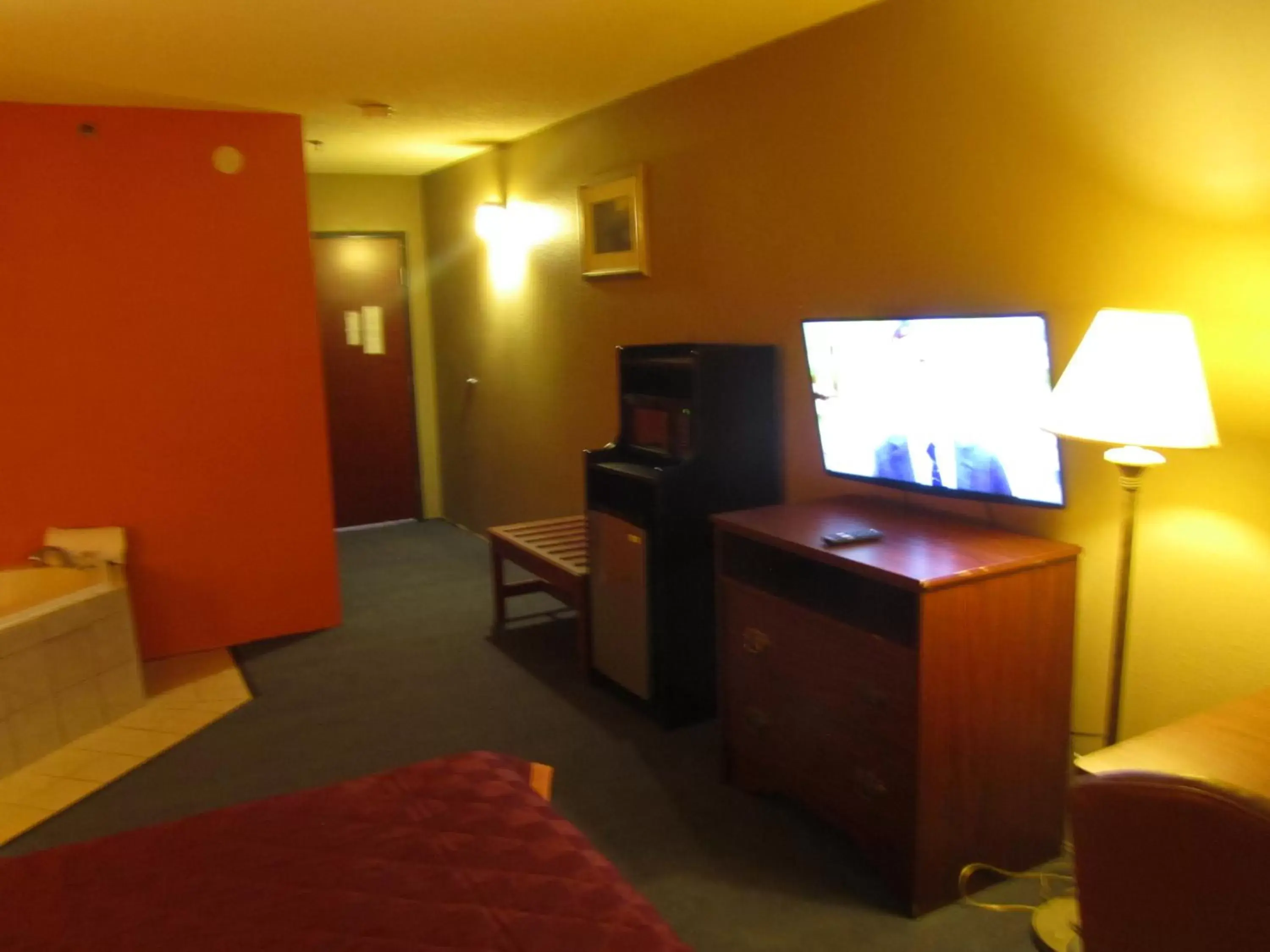 Bed, TV/Entertainment Center in Executive Inn and Suites Wichita Falls