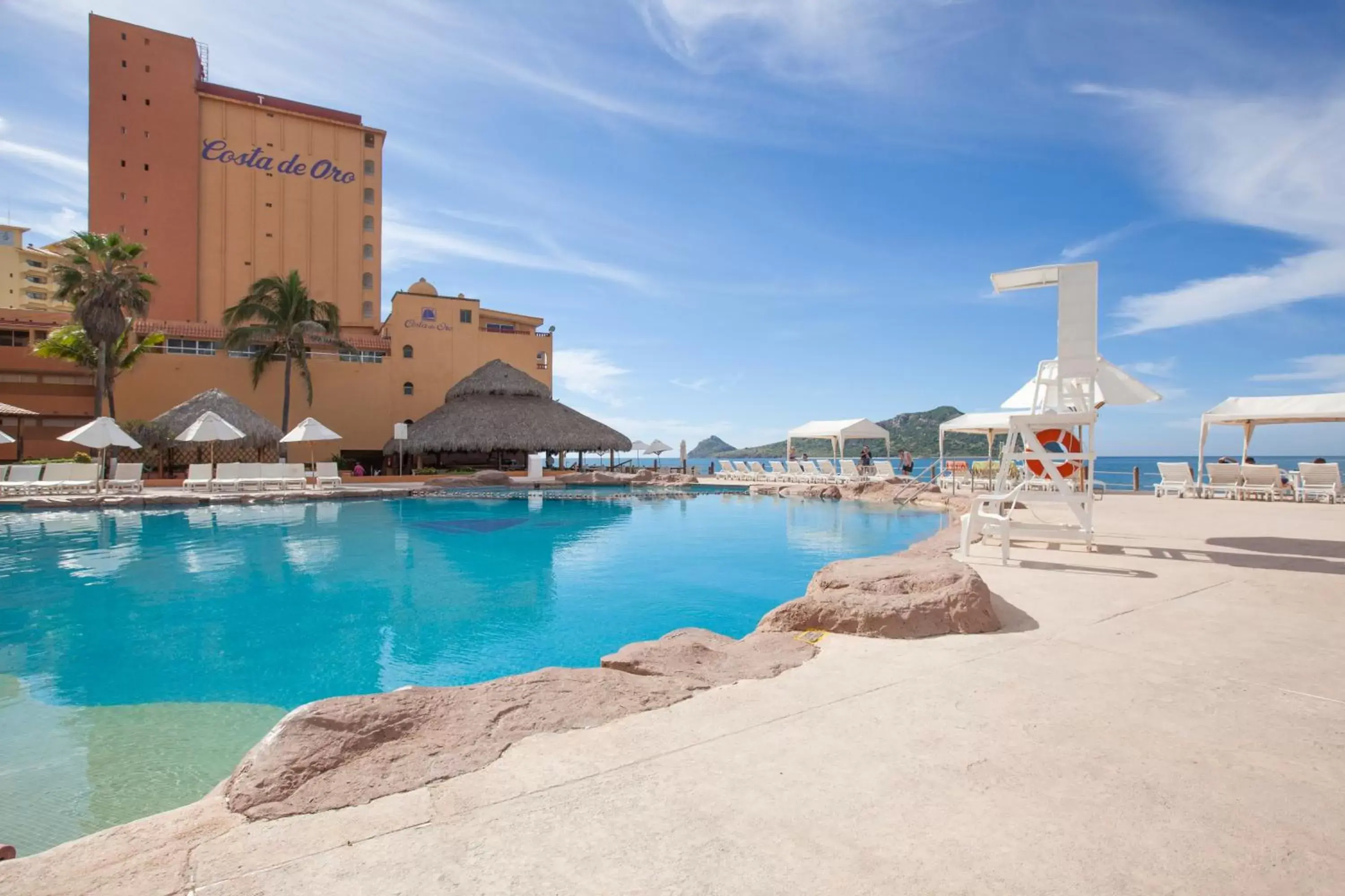 Pool view, Property Building in Costa de Oro Beach Hotel