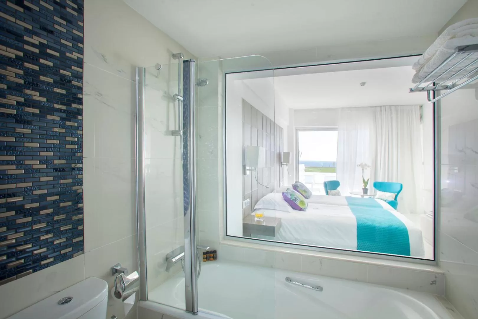 Bathroom, Bed in King Evelthon Beach Hotel & Resort
