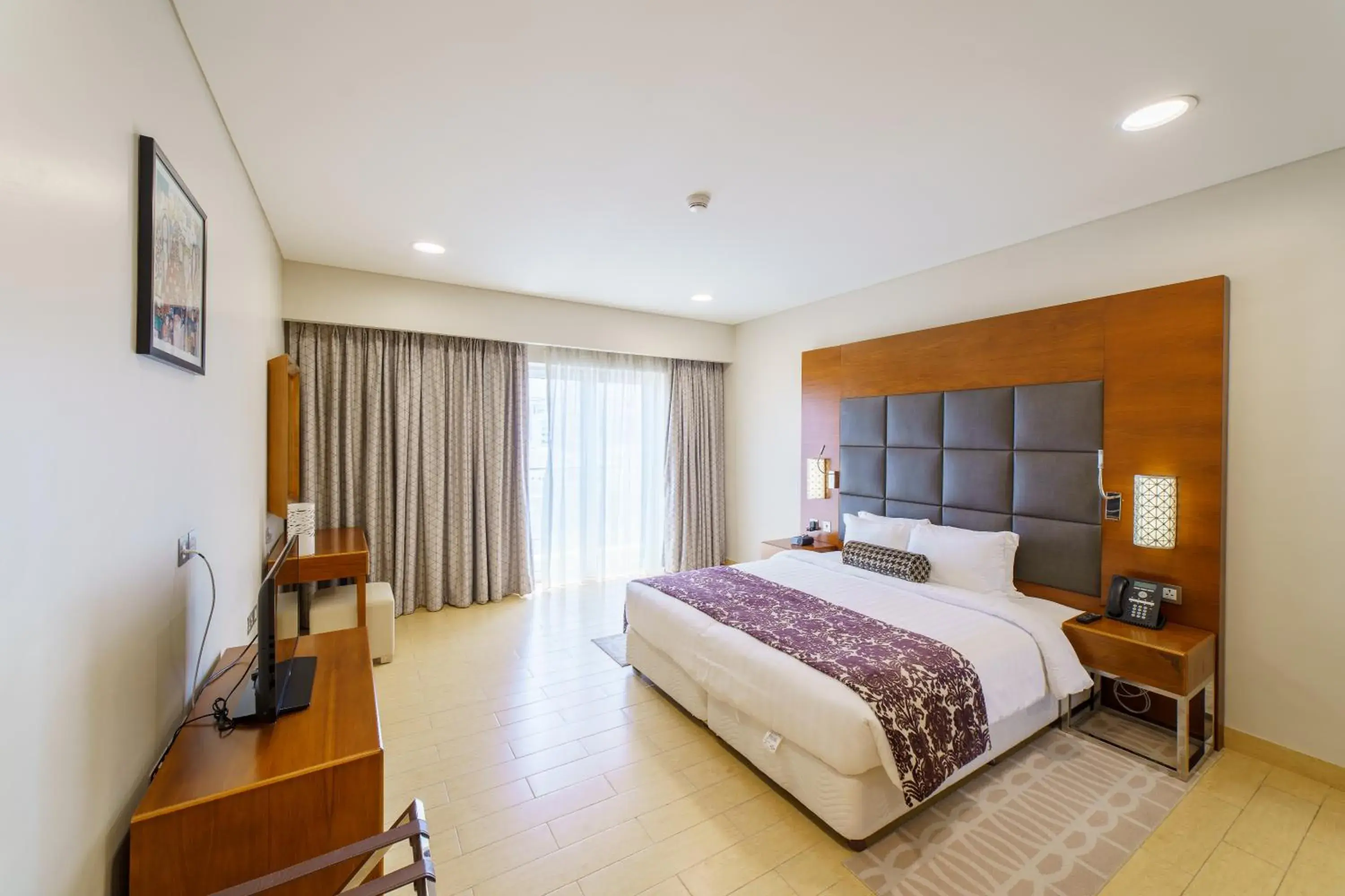 Bed in Levatio Suites Muscat, a member of Radisson Individuals