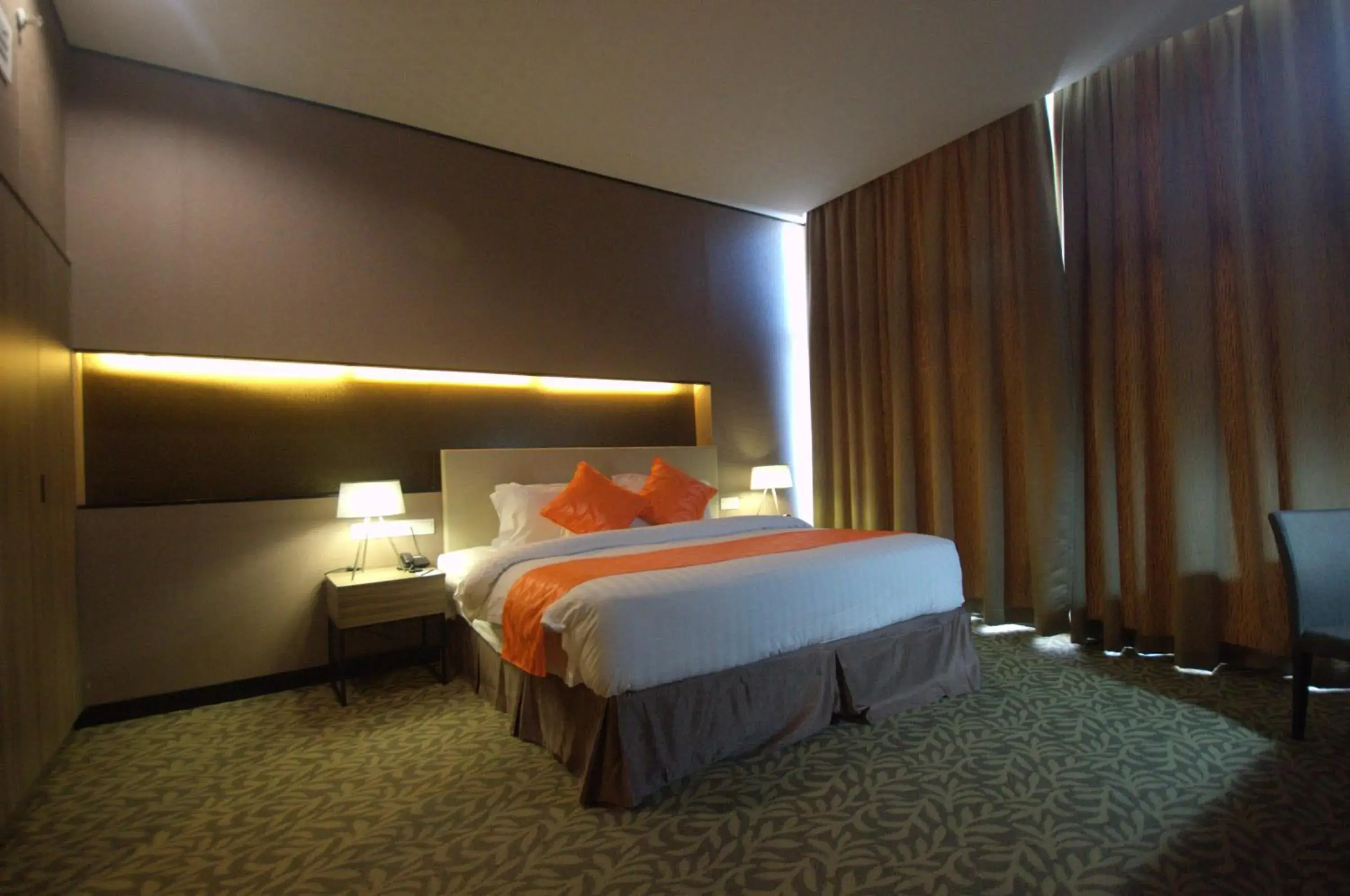 Bed in Grand Alora Hotel