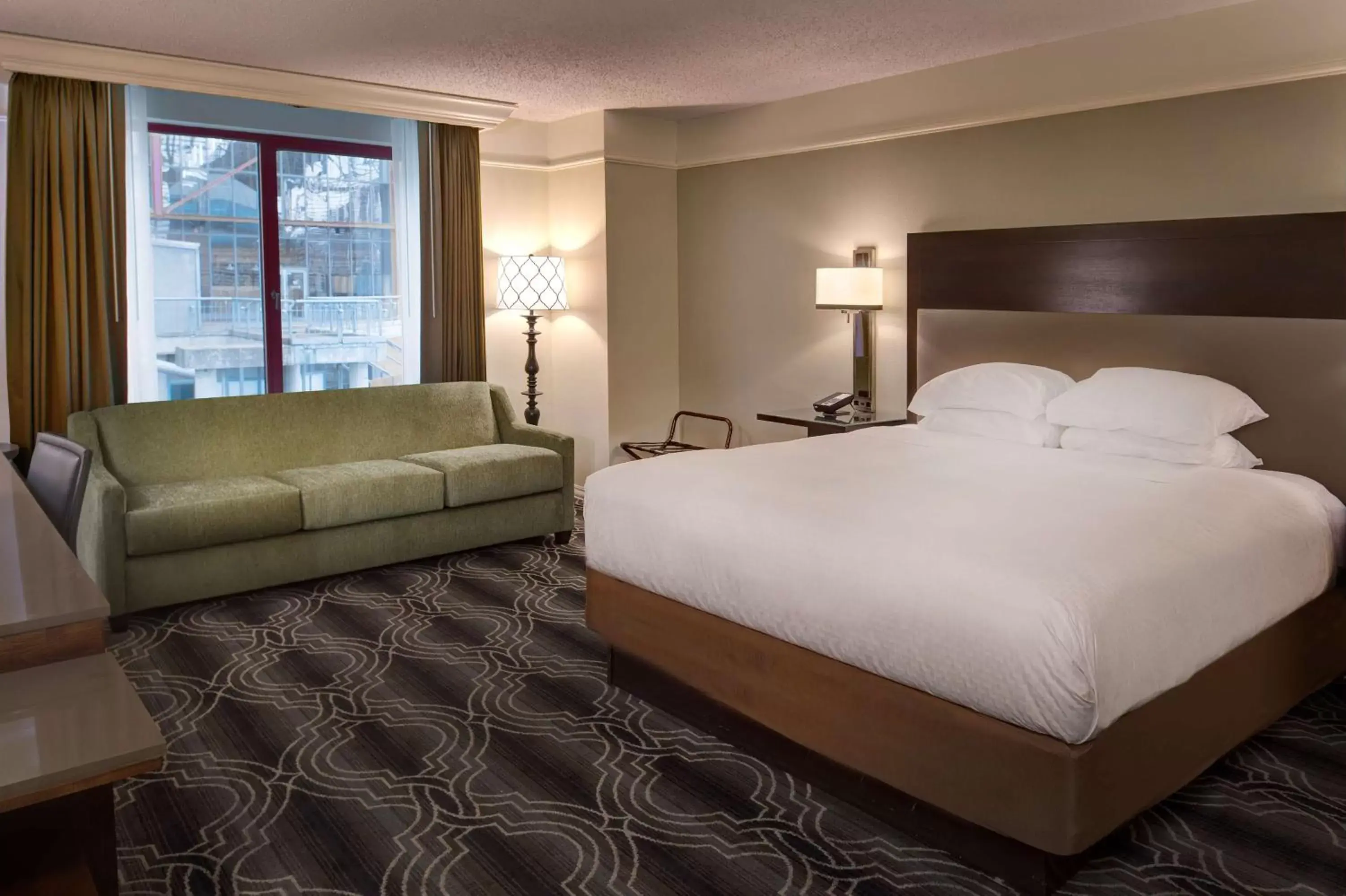 Living room, Bed in St. Louis Union Station Hotel, Curio Collection by Hilton