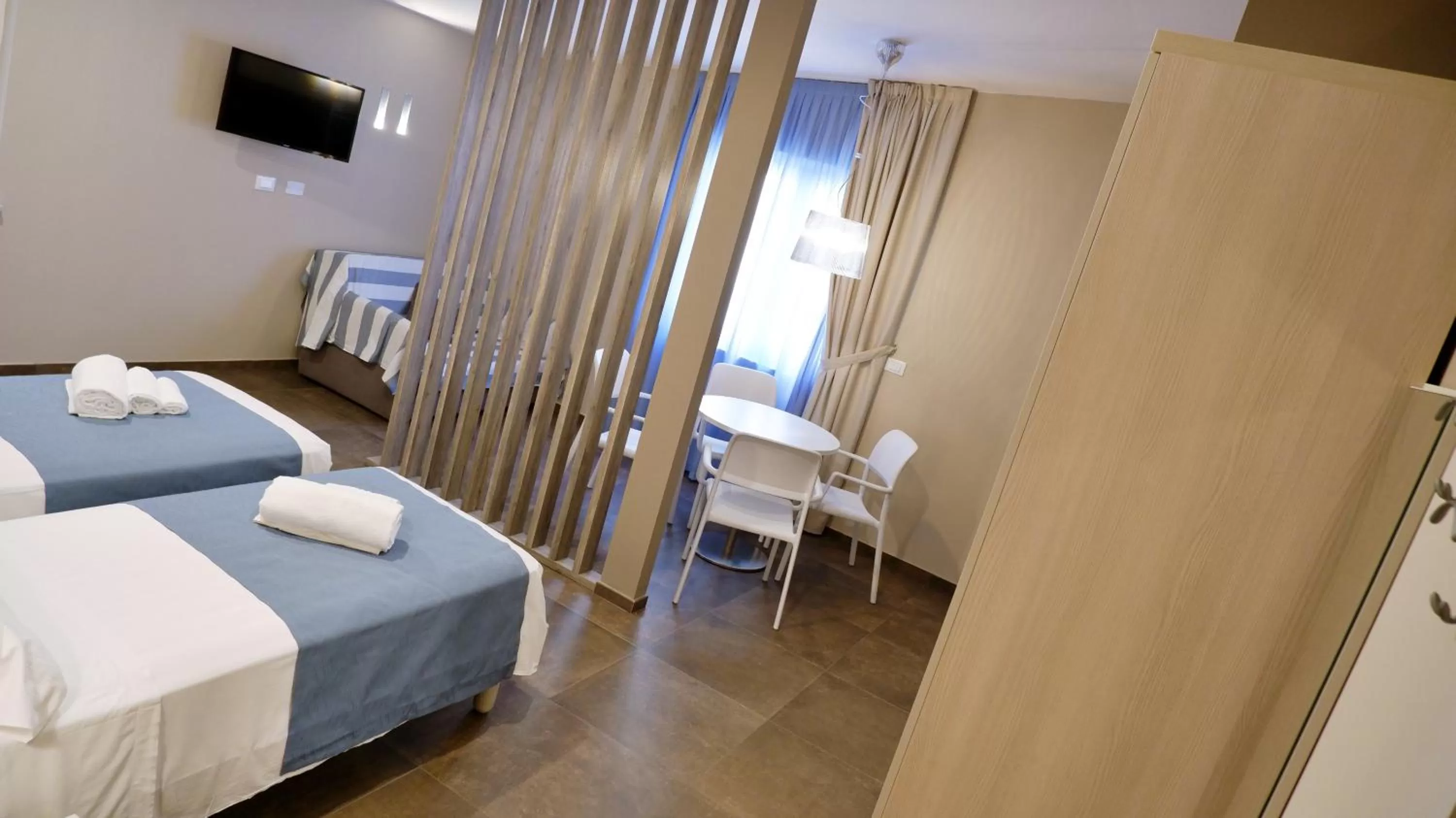 TV/Entertainment Center in Pianomare Riviera Apartments and Rooms