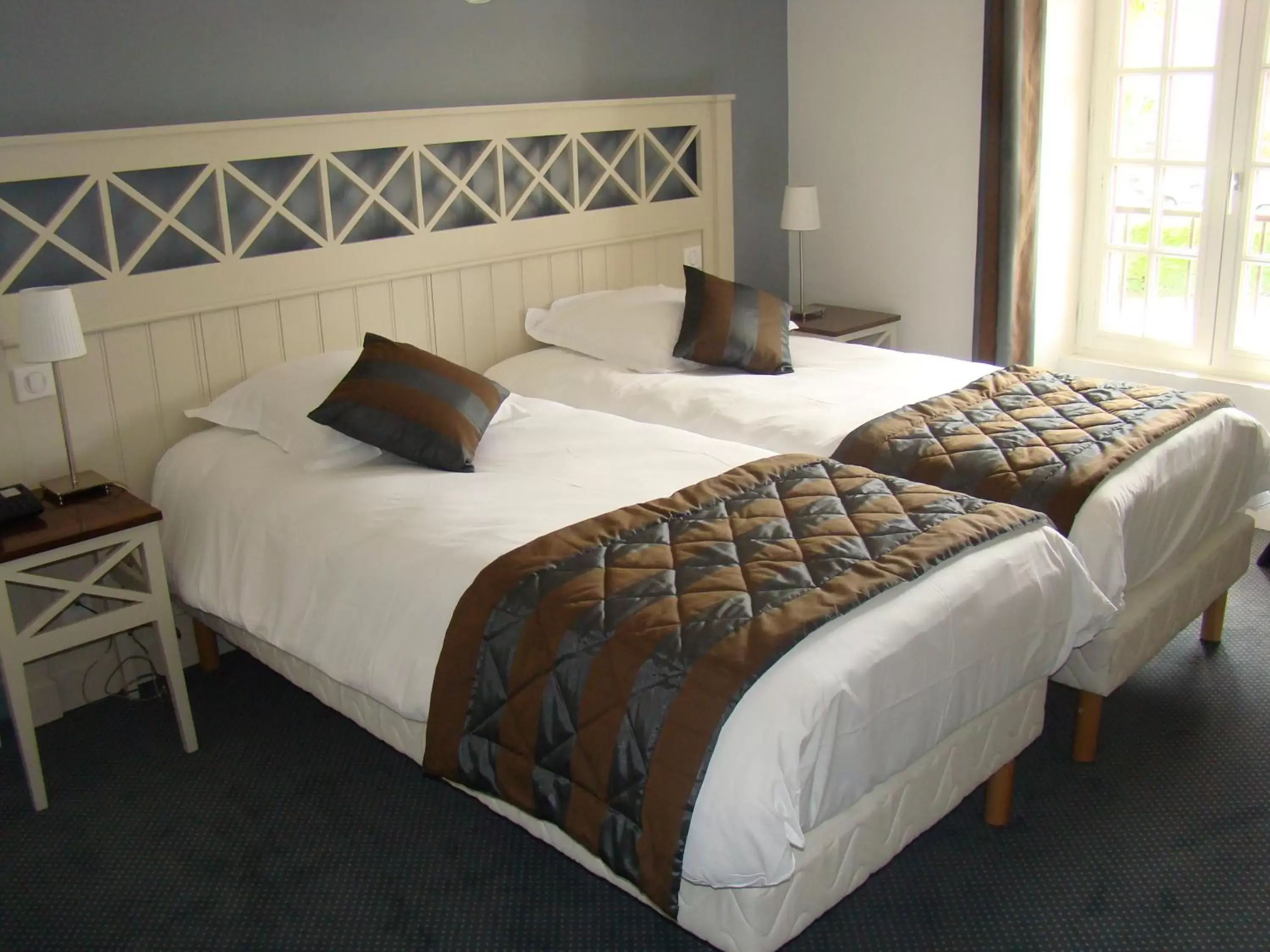 Bed in Logis Hotel, restaurant et spa Le Relais De Broceliande