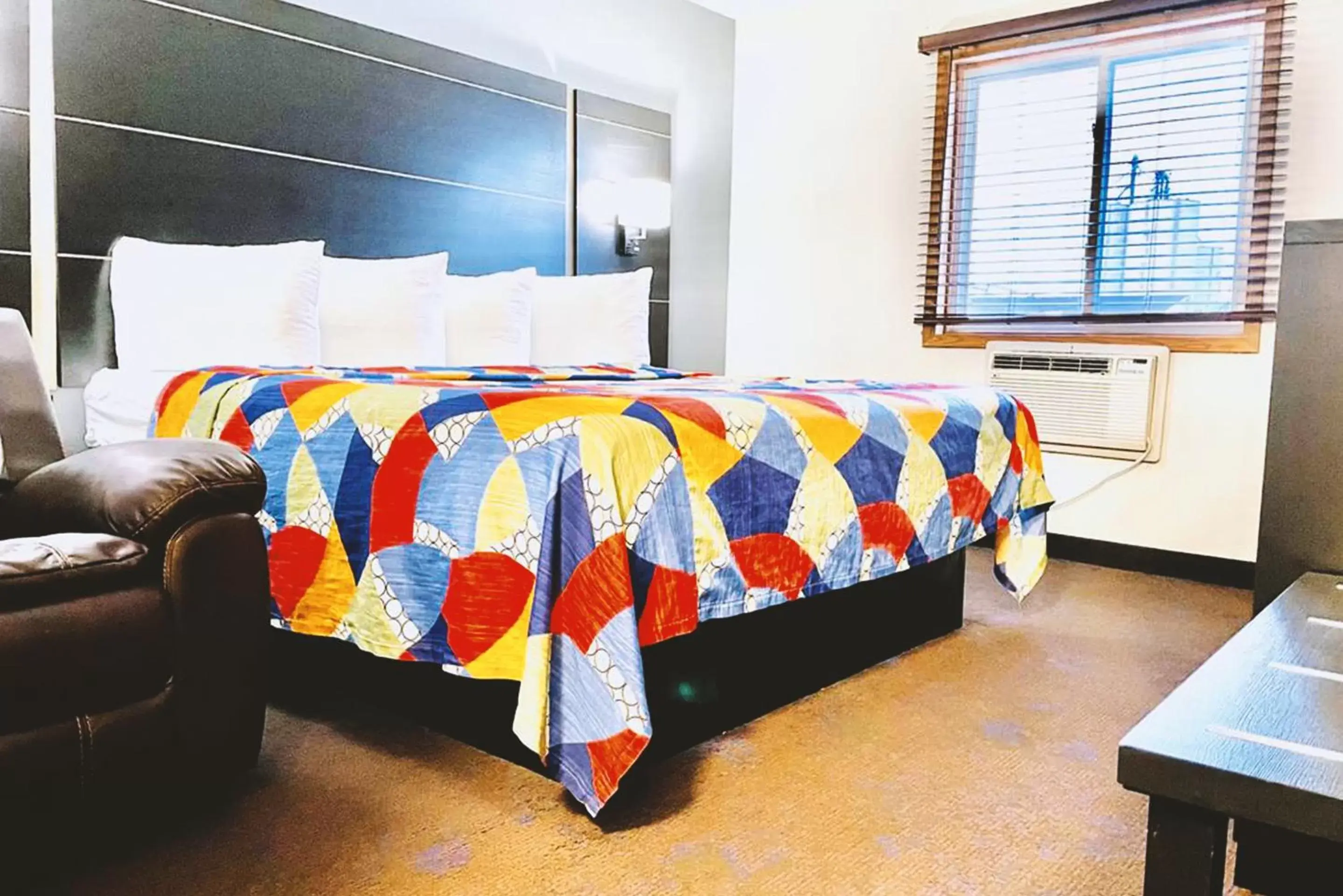 Bed in Coratel Inn & Suites by Jasper Northfield