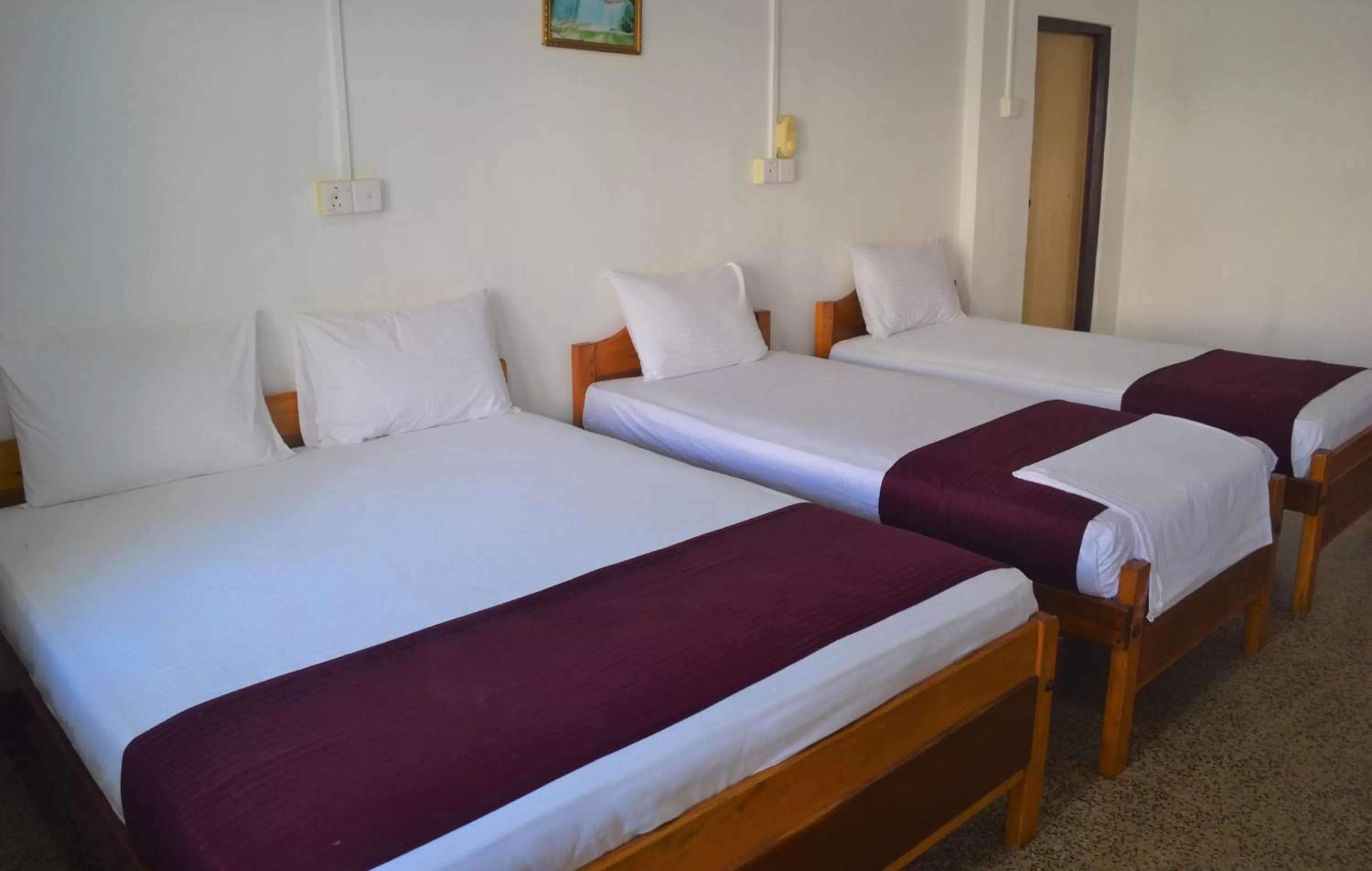 Bed in Gnaanams Hotel and Restaurant
