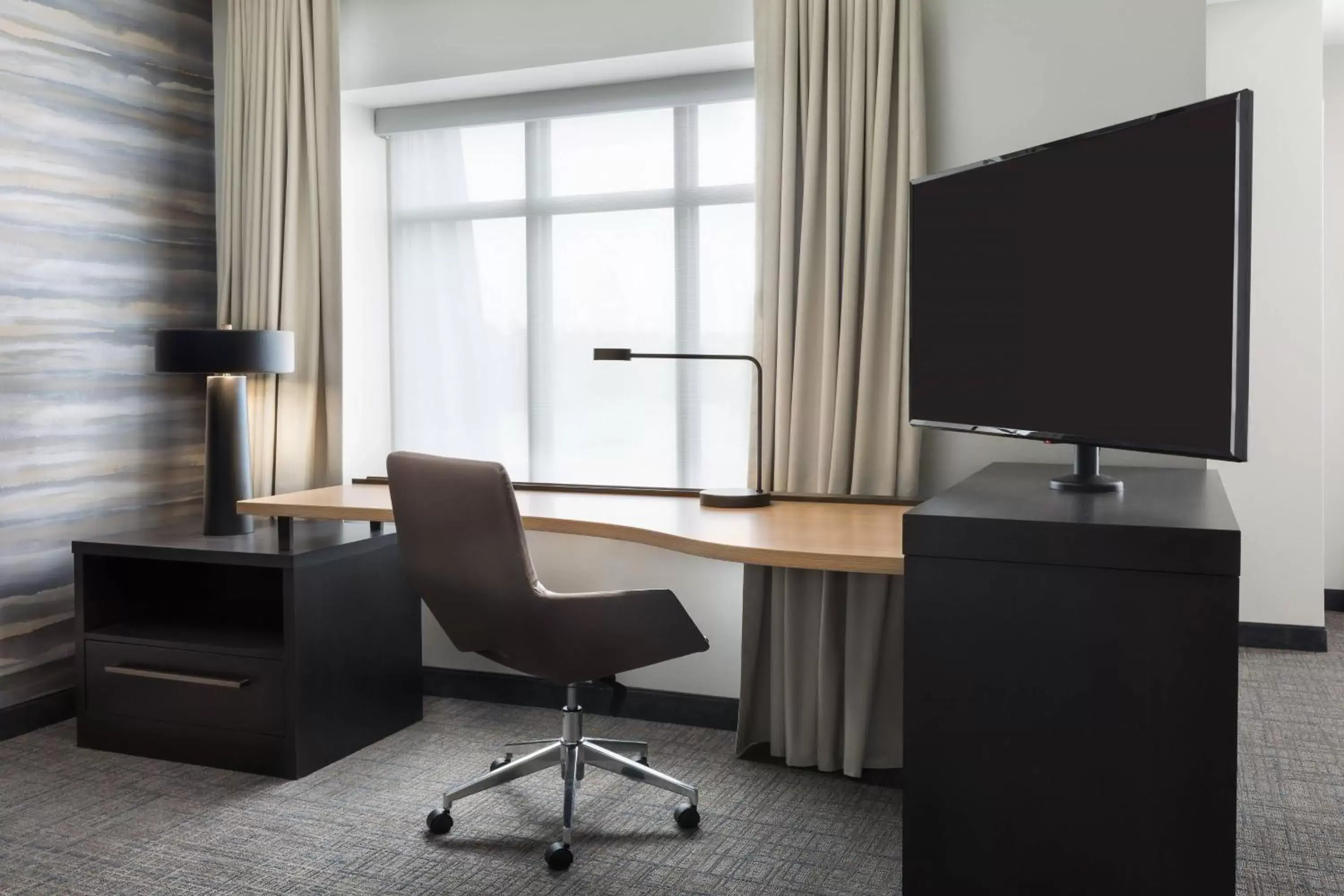 Photo of the whole room, TV/Entertainment Center in Residence Inn Long Island Garden City