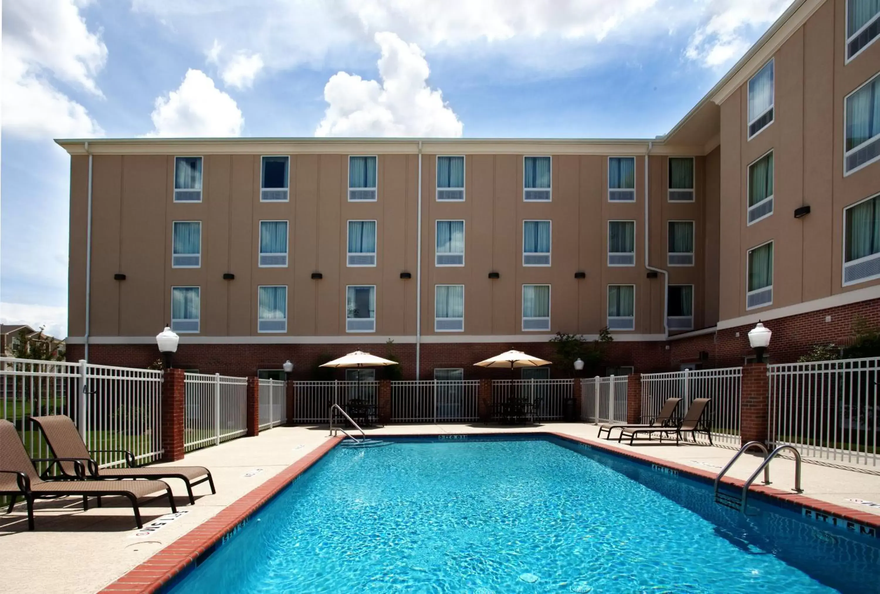 Swimming pool, Property Building in Holiday Inn Express & Suites Baton Rouge East, an IHG Hotel