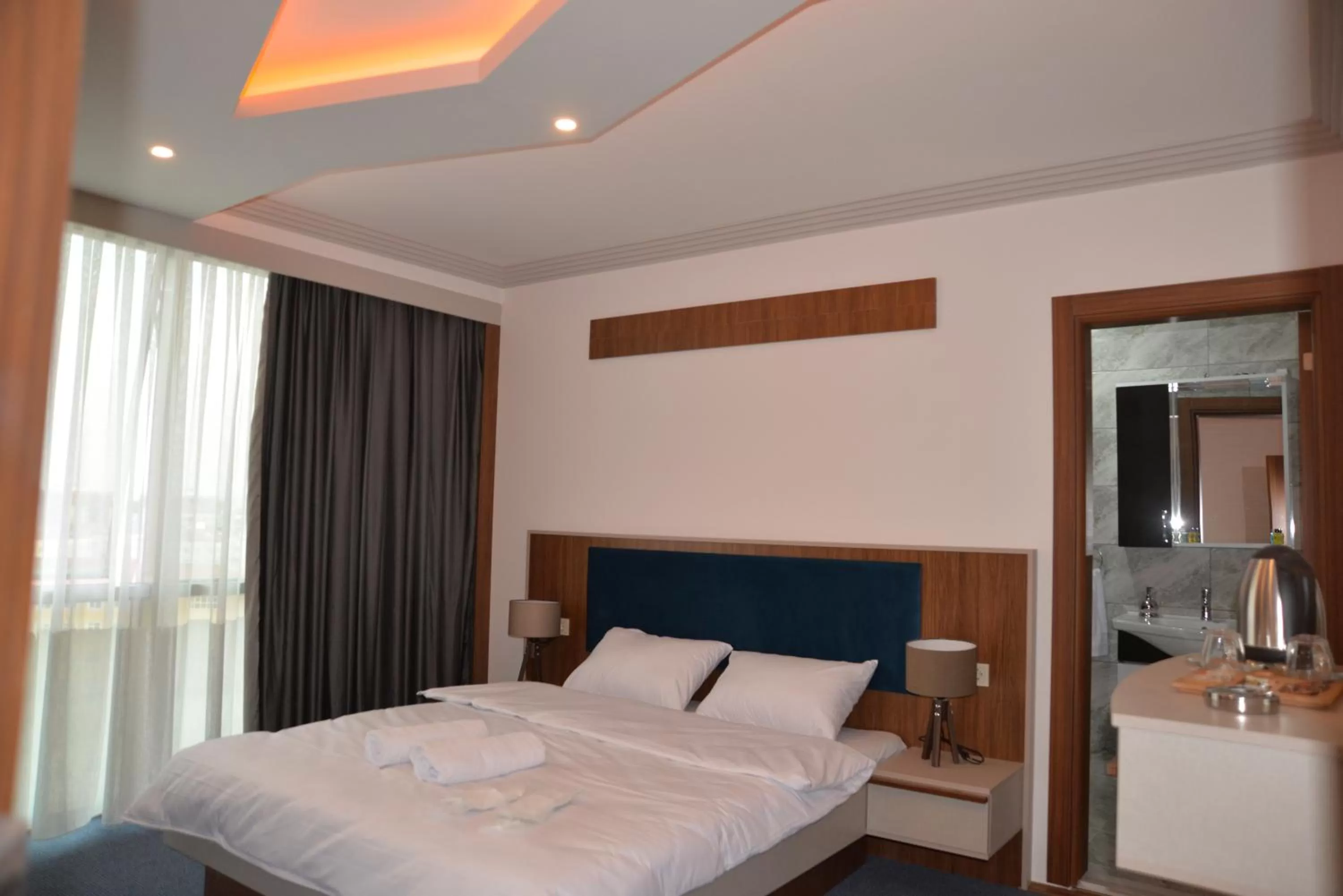 Bed in TEVETOGLU HOTEL