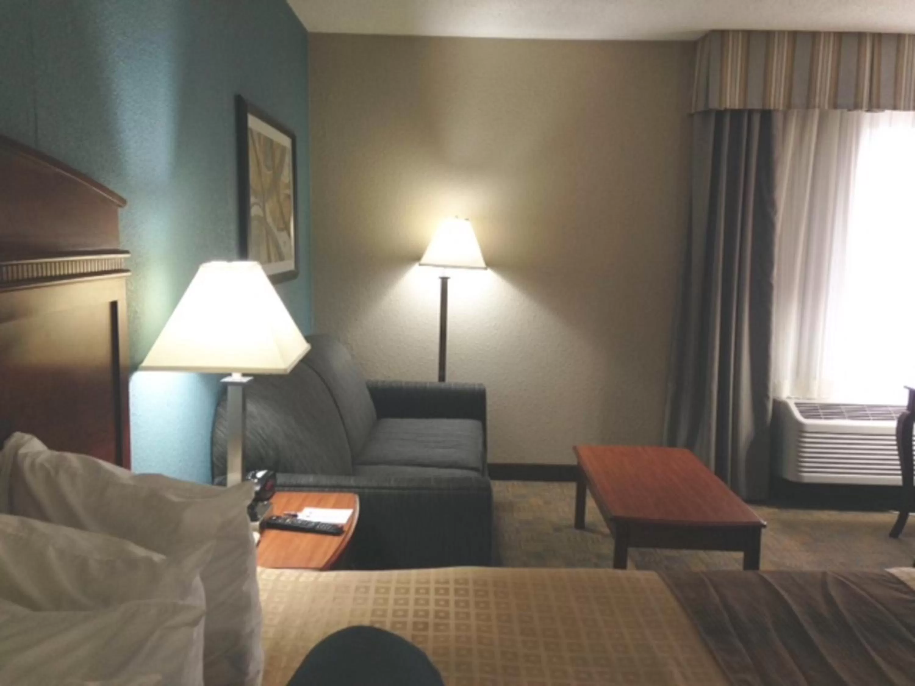 Seating area, Bed in Days Inn by Wyndham Englewood Dayton Airport