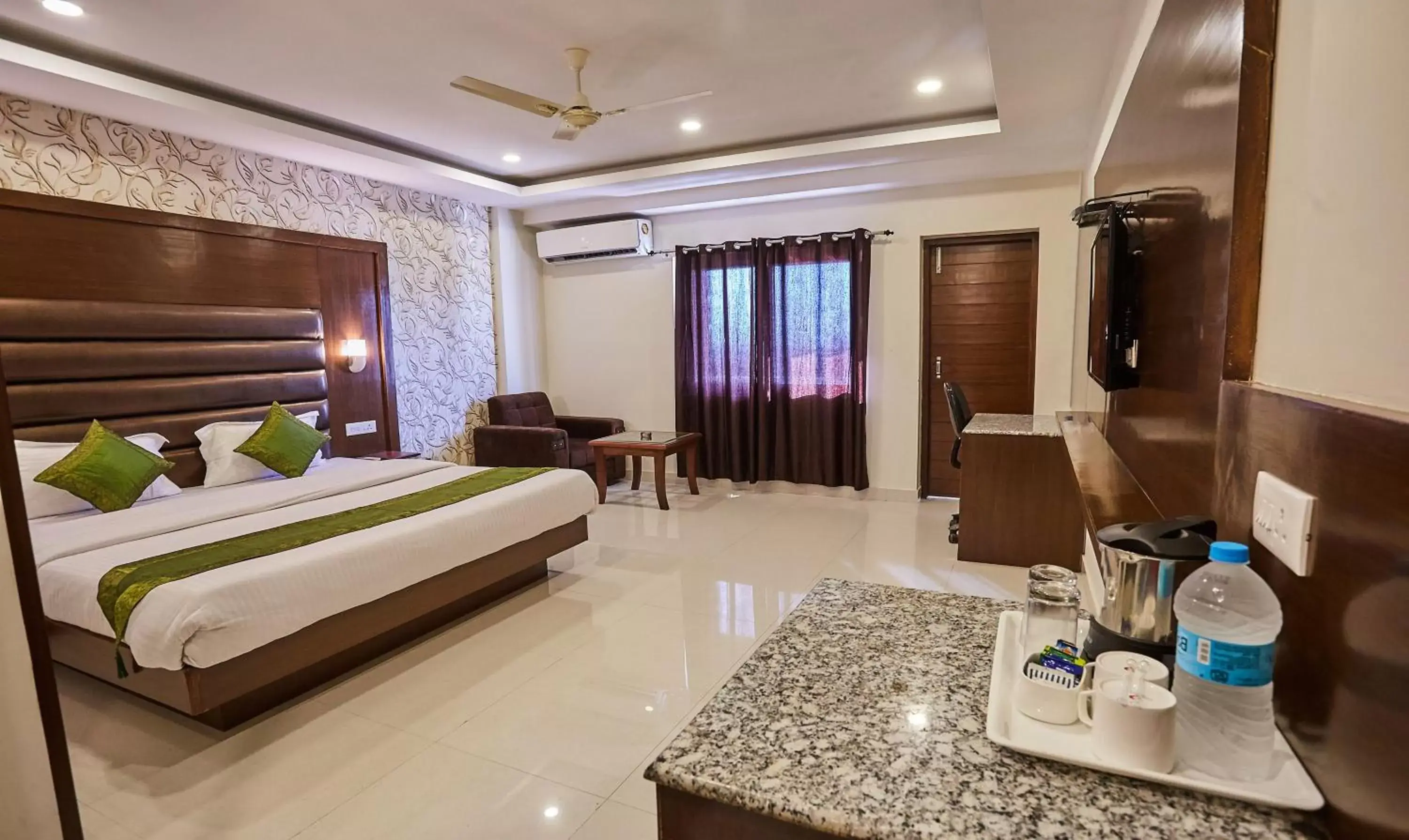 TV and multimedia, Bed in Treebo Grand Legacy Elite With Roof Top Cafe TV and multimedia, Bed in Treebo Grand Legacy Elite With Roof Top Cafe