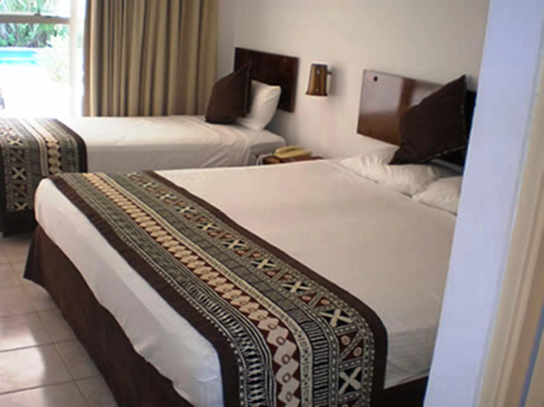 Bed in Capricorn International Hotel