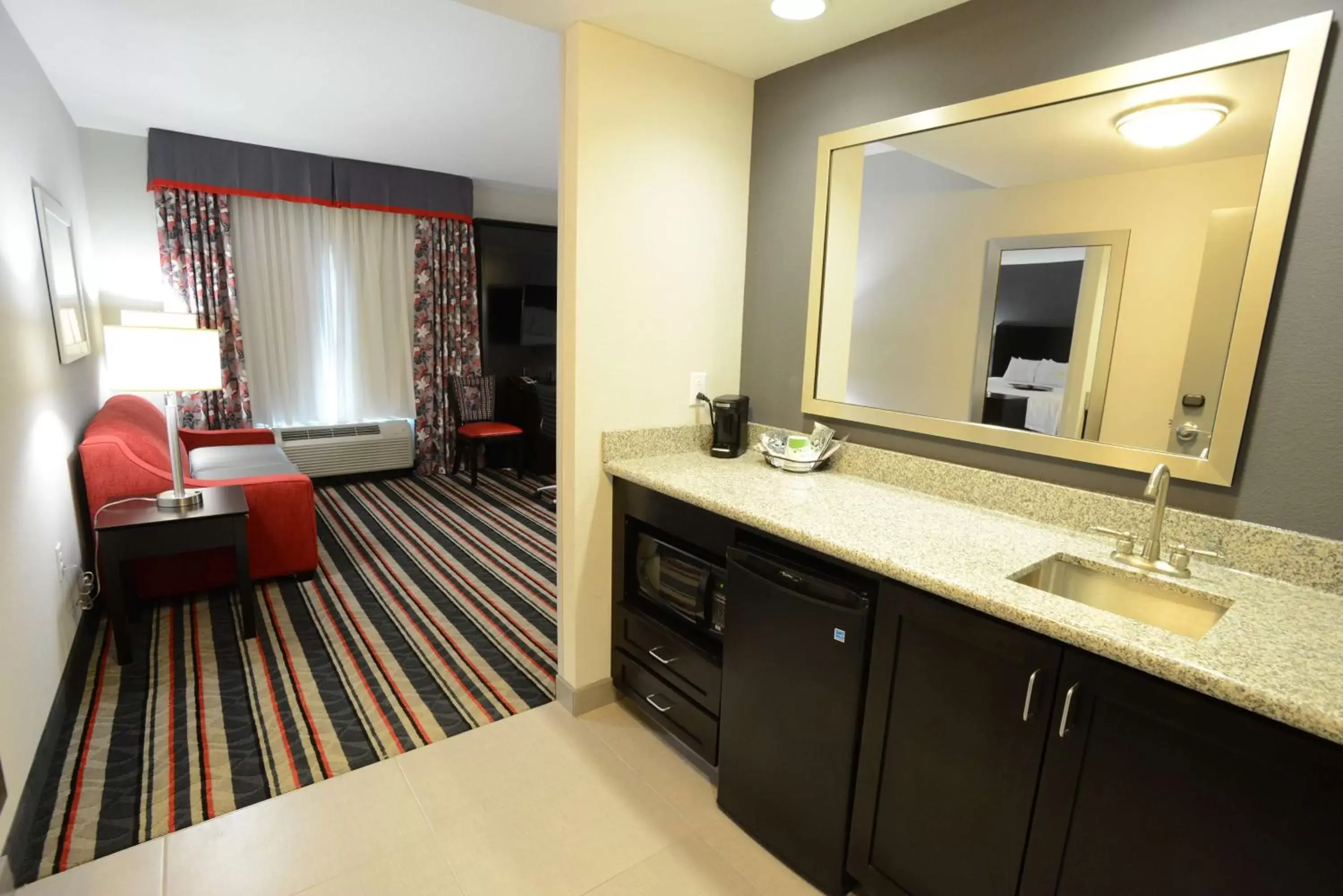 Living room, Bathroom in Hampton Inn & Suites Albany at Albany Mall