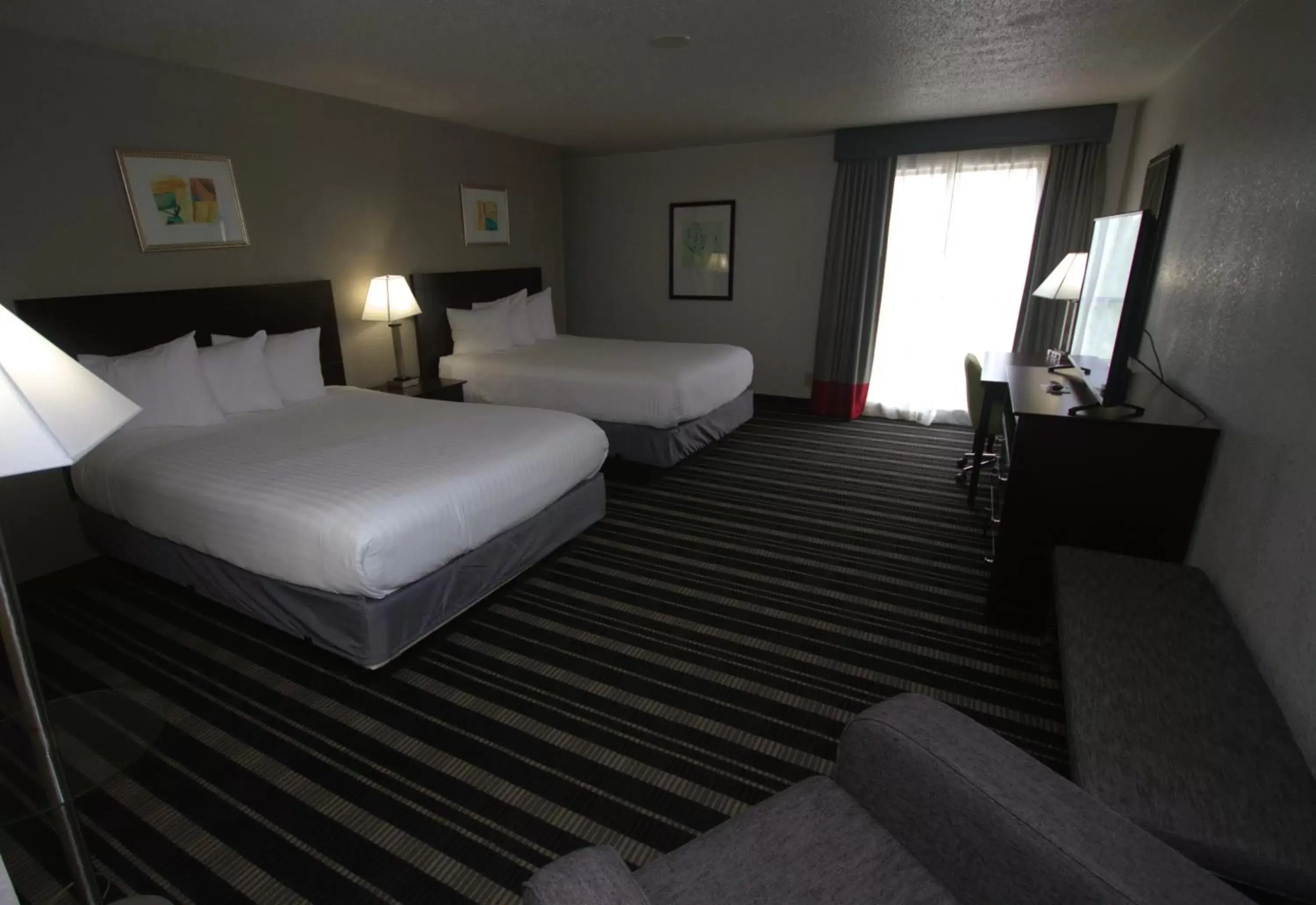 Bedroom, Bed in Atrium Hotel and Suites DFW Airport