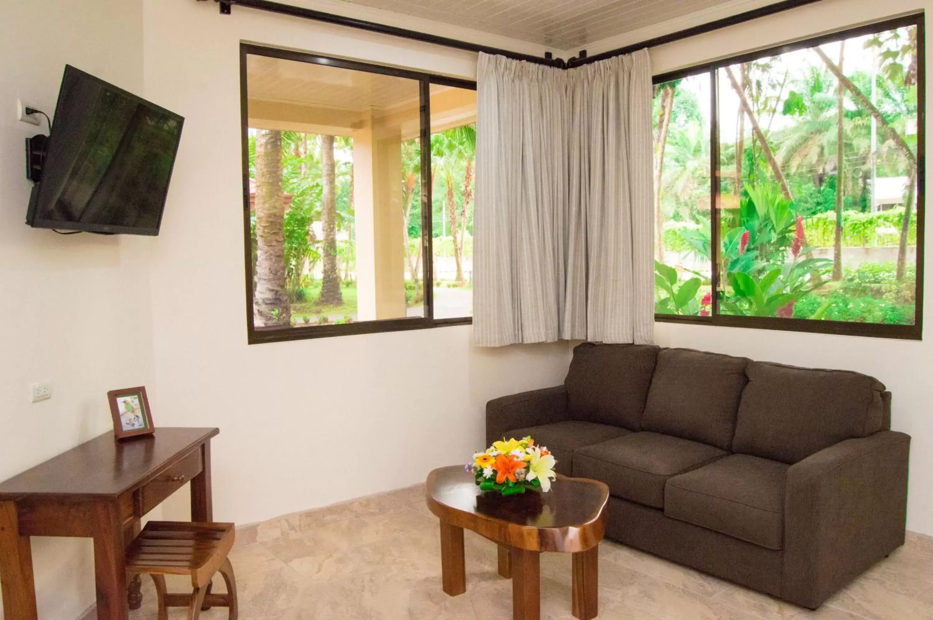 Bed, Seating Area in La Foresta Nature Resort