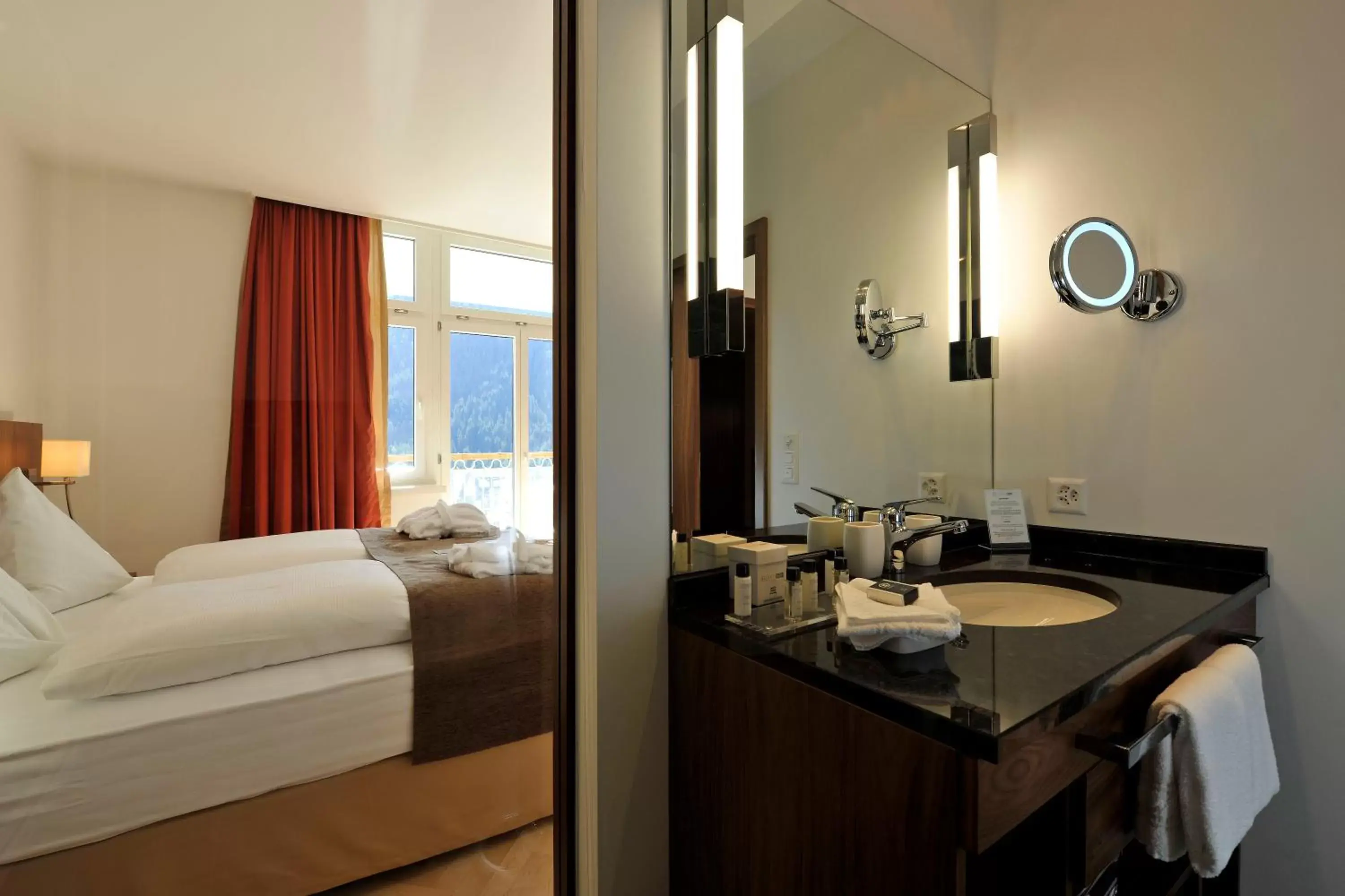 Bed, Bathroom in Waldhotel & SPA Davos - for body & soul