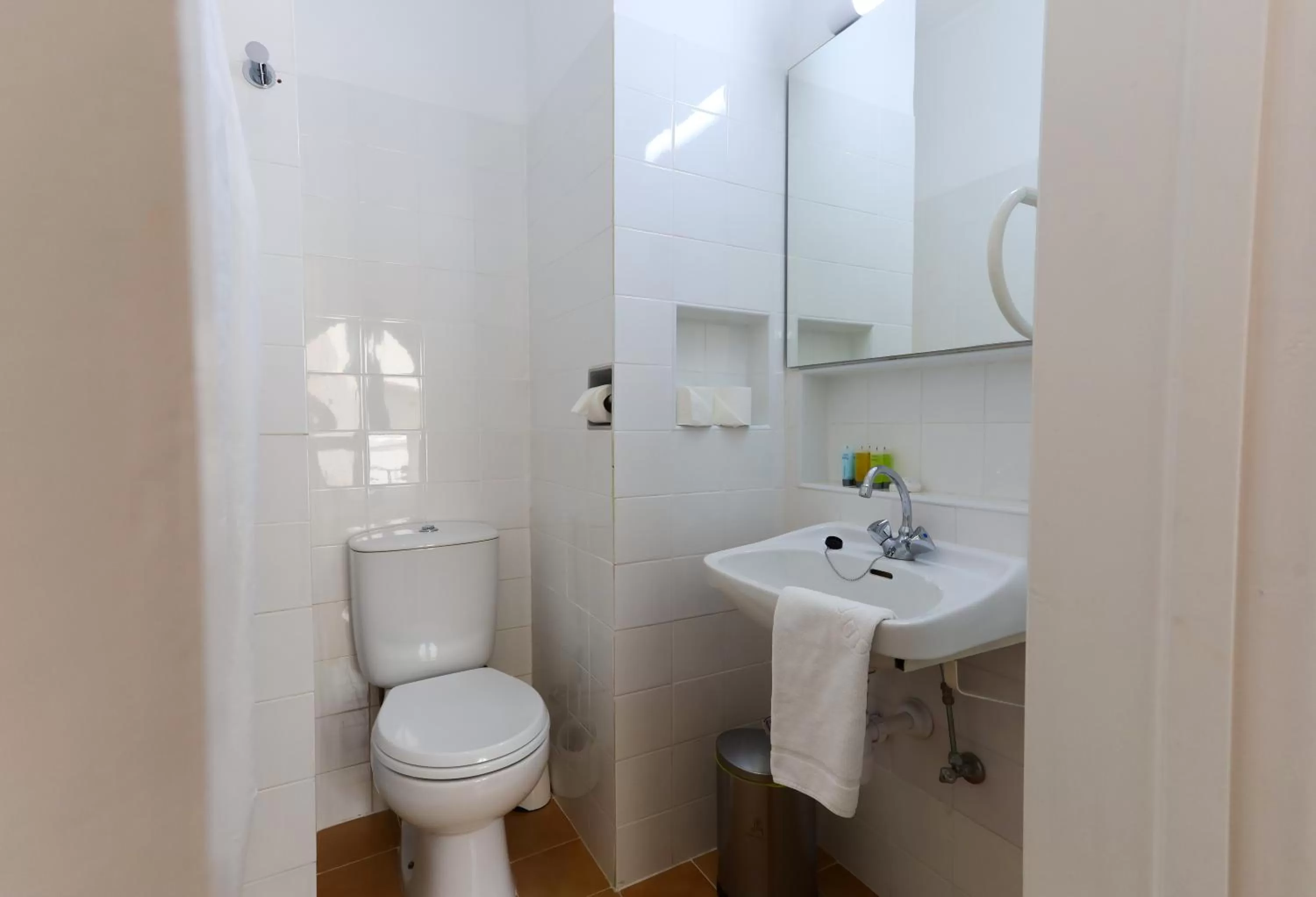 Toilet in Axiothea Hotel