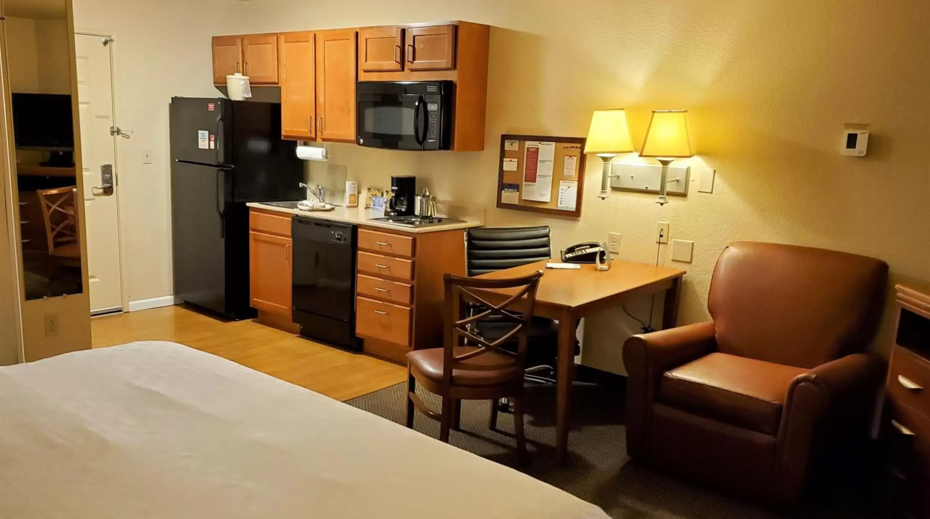 Photo of the whole room, Kitchen/Kitchenette in Candlewood Suites Fayetteville, an IHG Hotel