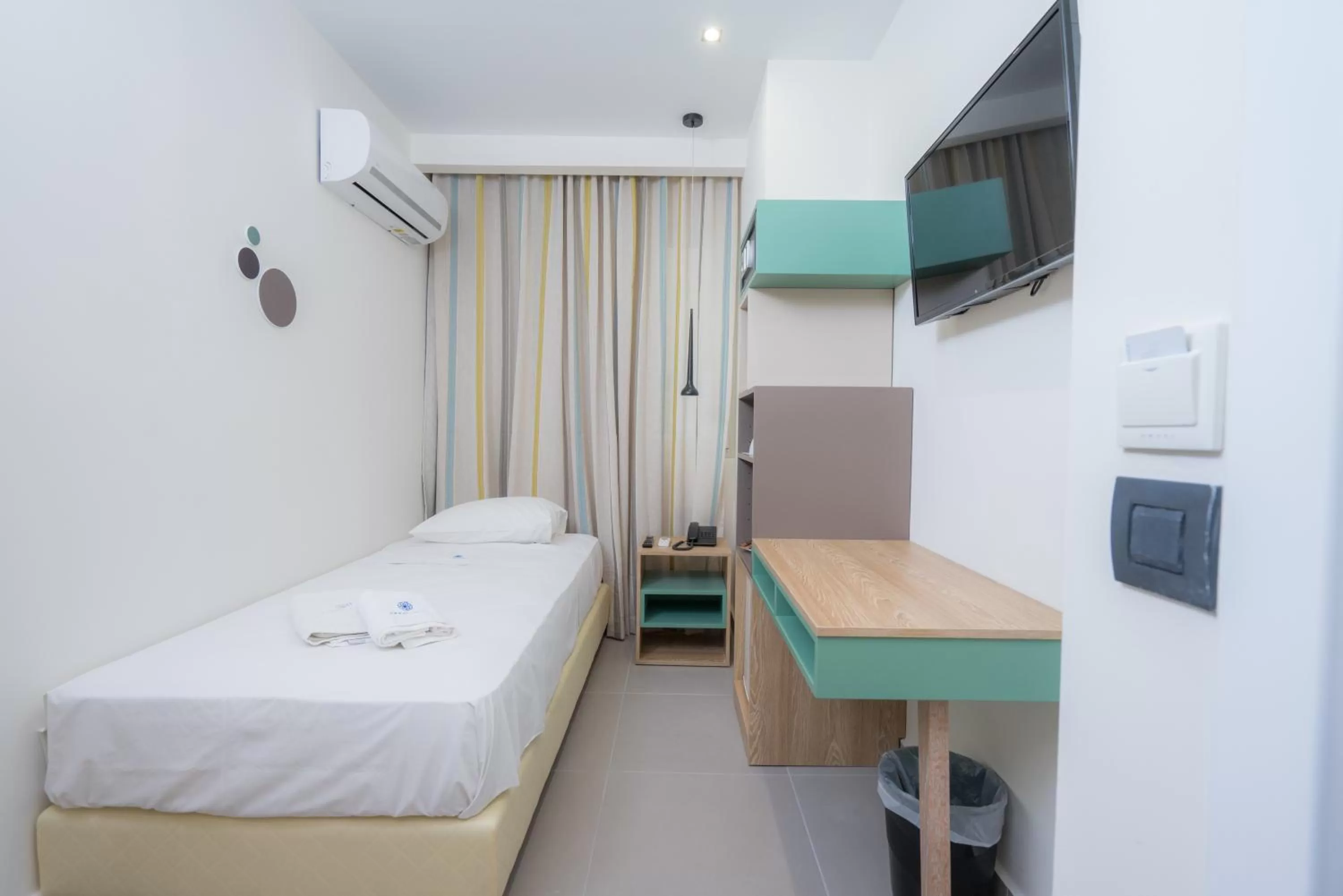 Bed in Infinity City Boutique Hotel