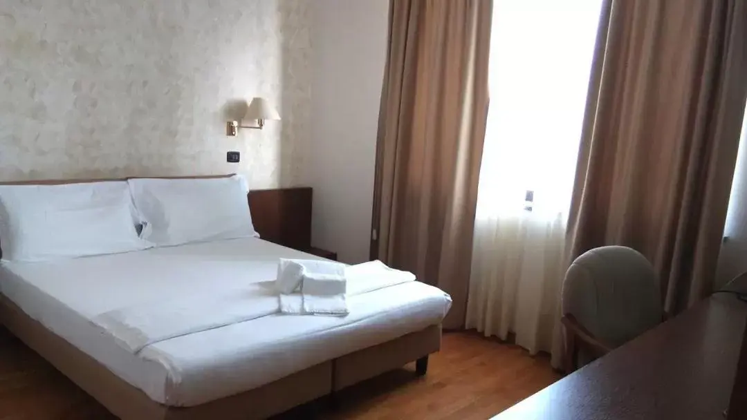Bed in HOTEL CAVALIERI