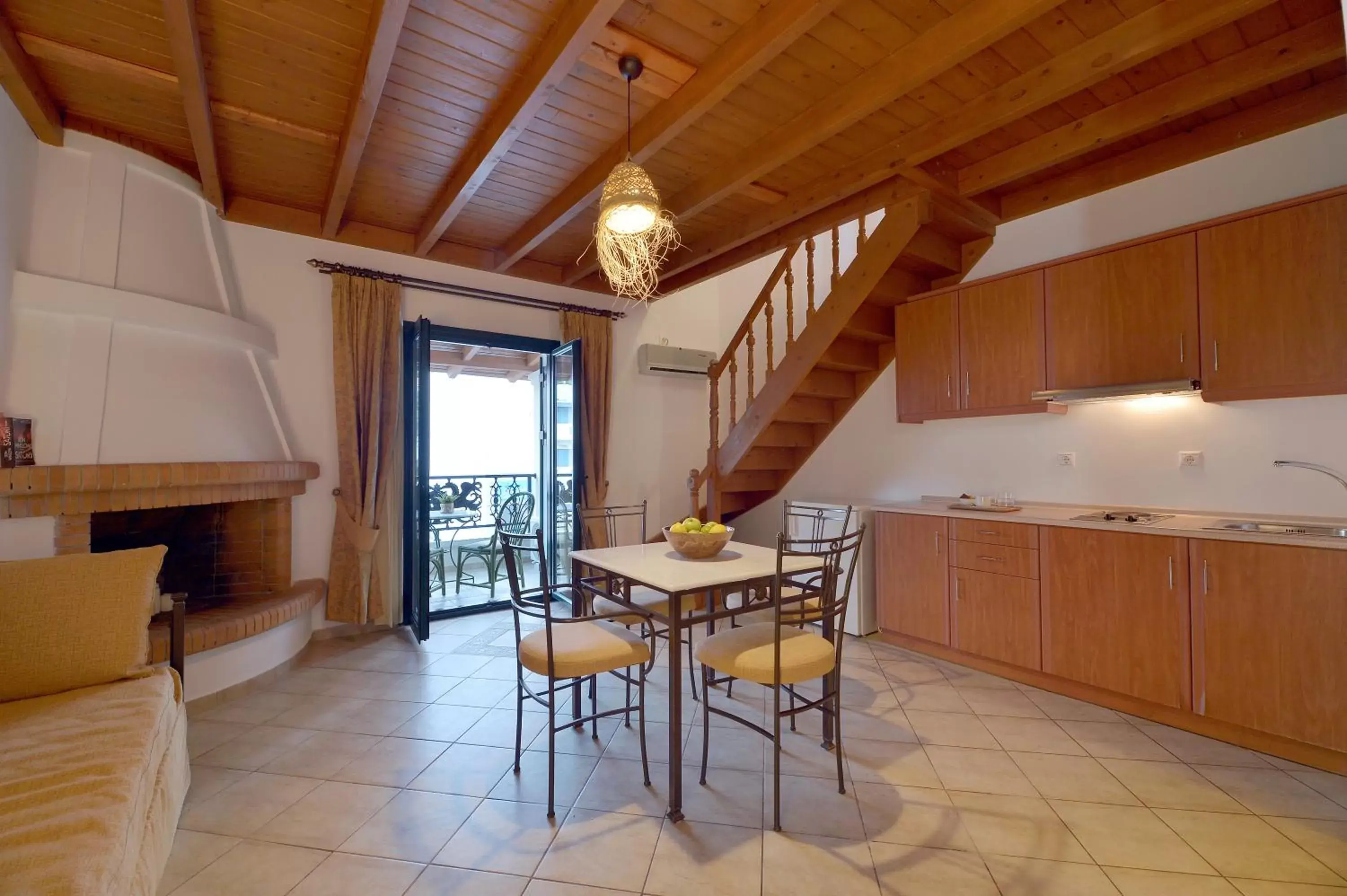 Living room, Kitchen/Kitchenette in Aktaion Beach Boutique Hotel & Spa