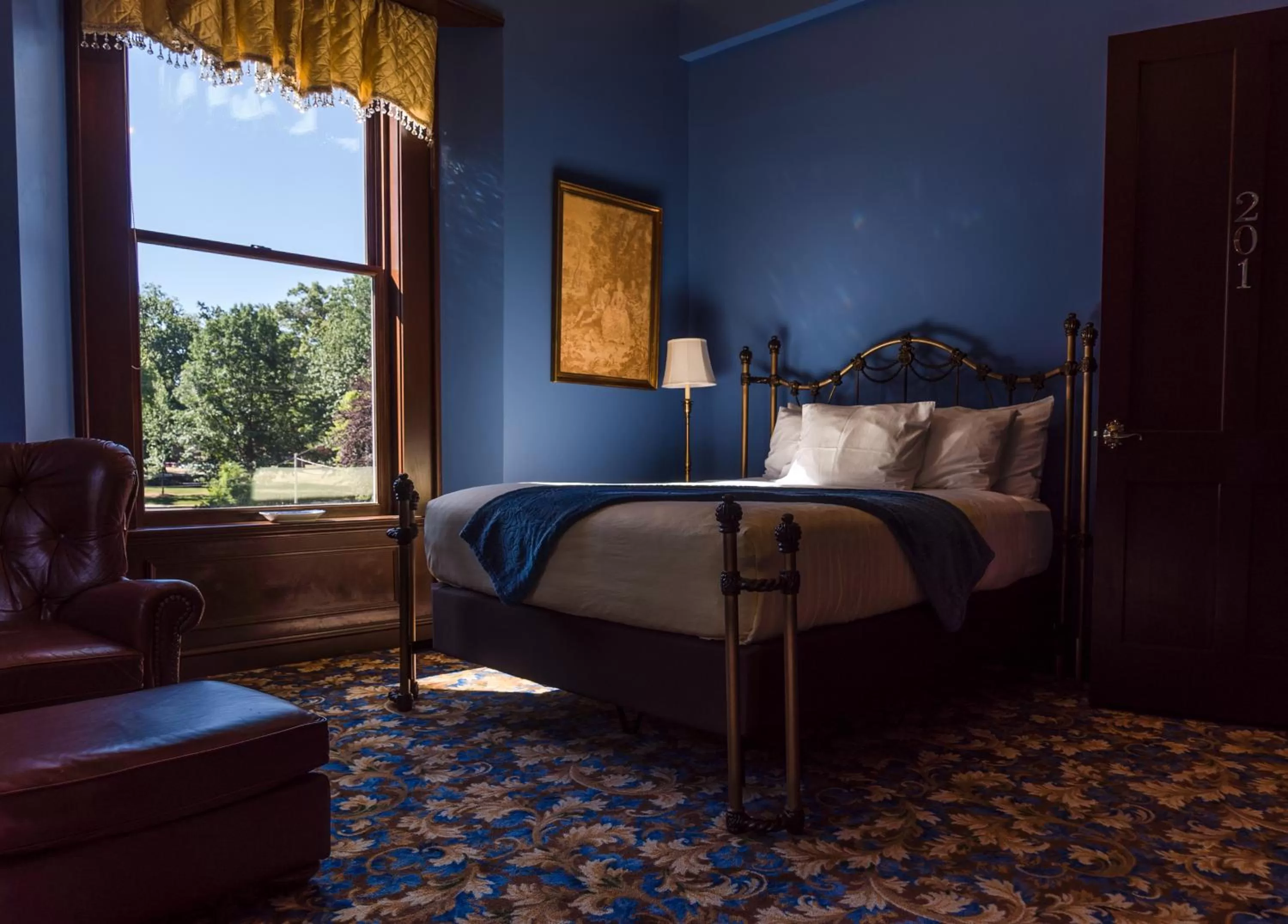 Bed in Steele Mansion Inn & Gathering Hub