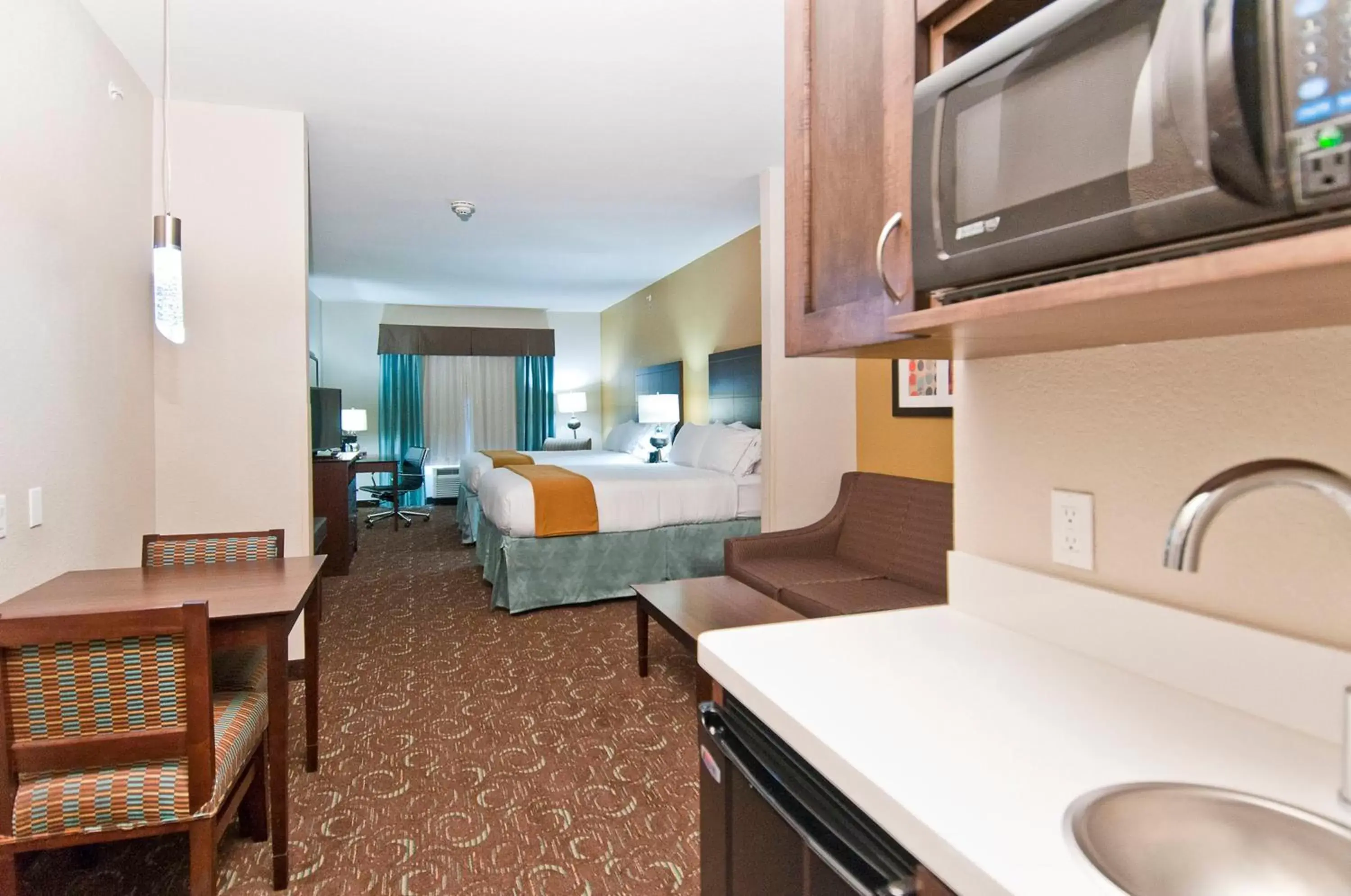 Photo of the whole room, Kitchen/Kitchenette in Holiday Inn Express & Suites San Antonio SE by AT&T Center, an IHG Hotel