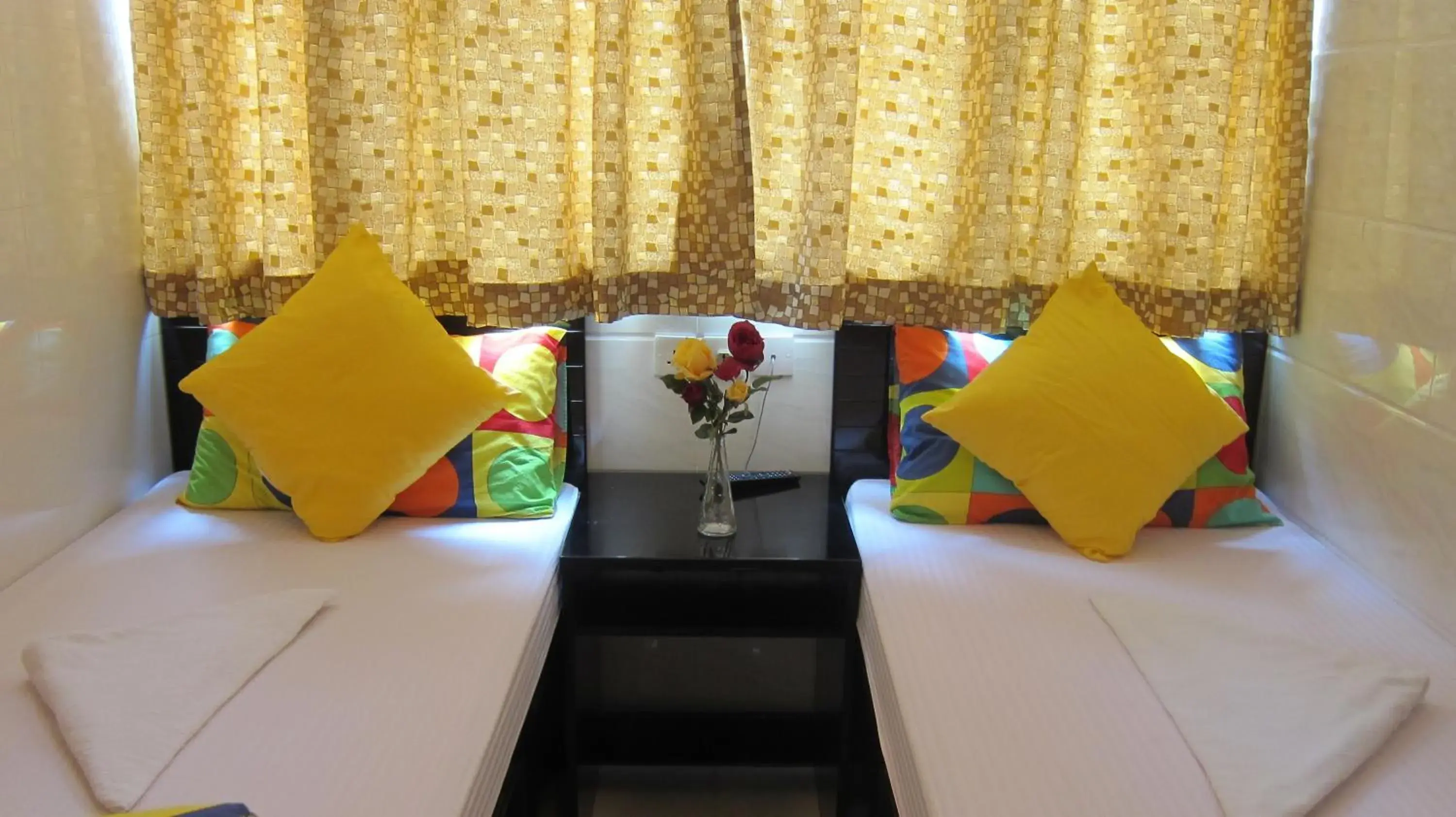 Bed, Seating Area in Ashoka Hostel