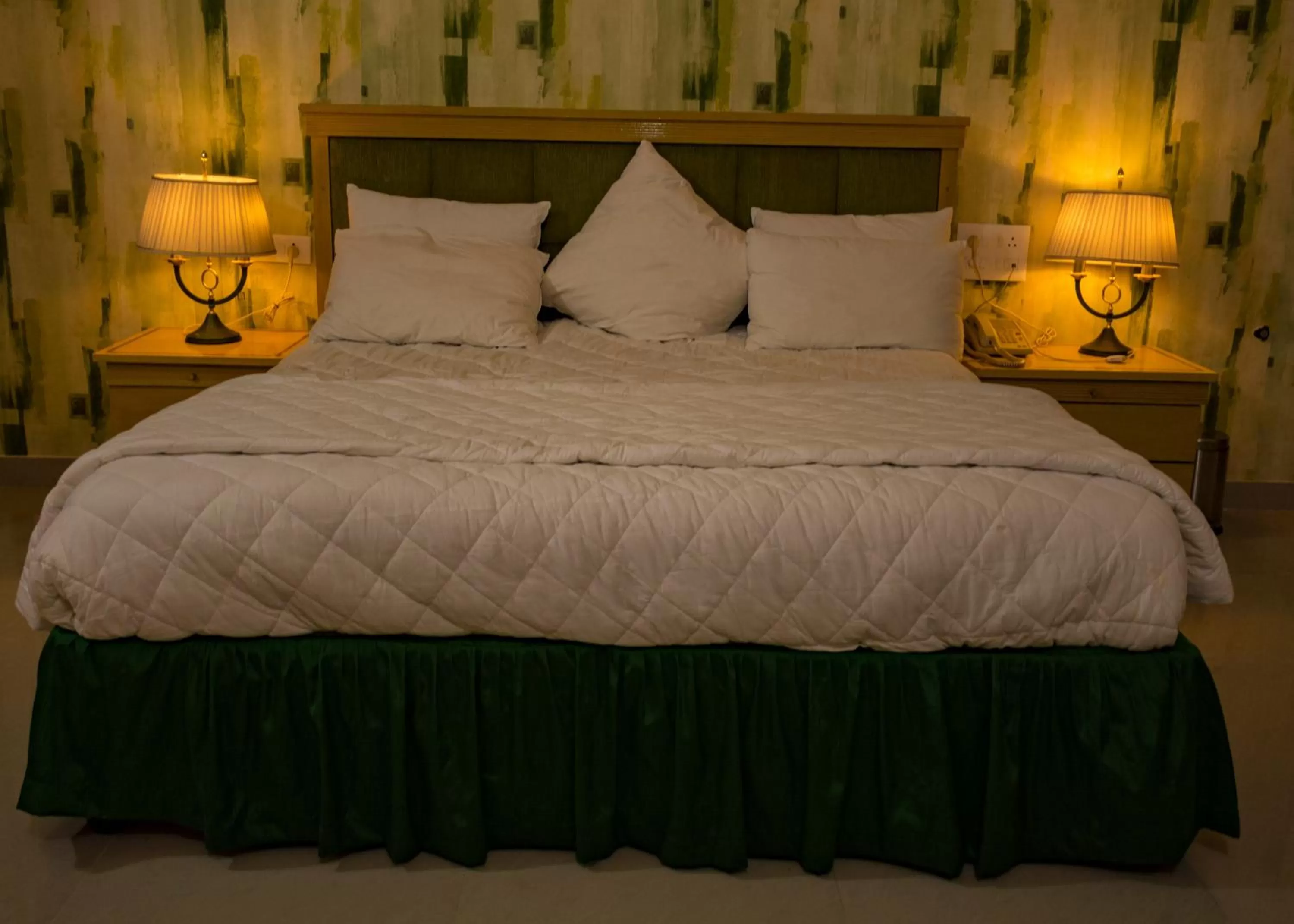 Bed in Mango Valley Resort Ganpatipule