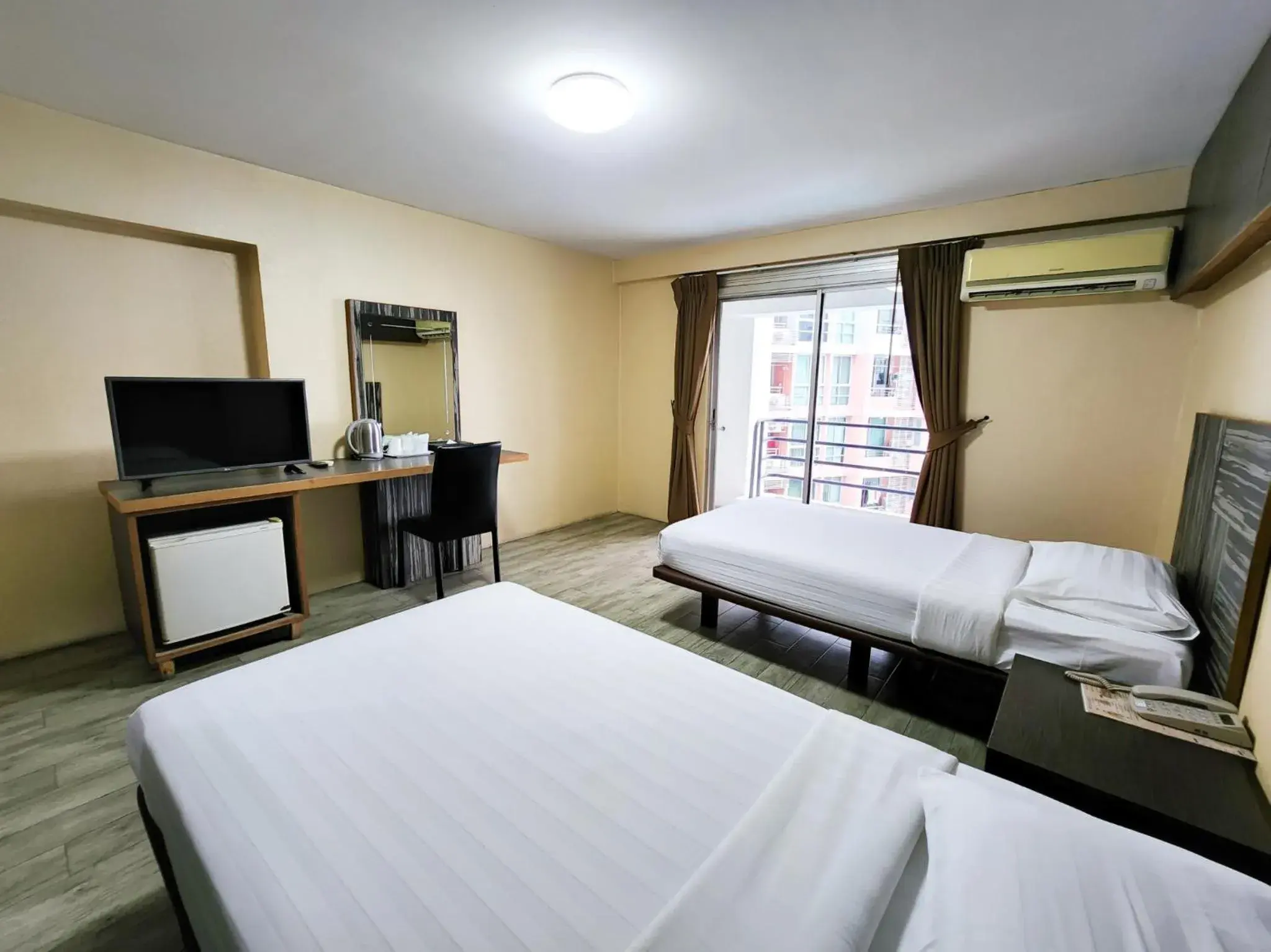 Bed in Watana Hotel