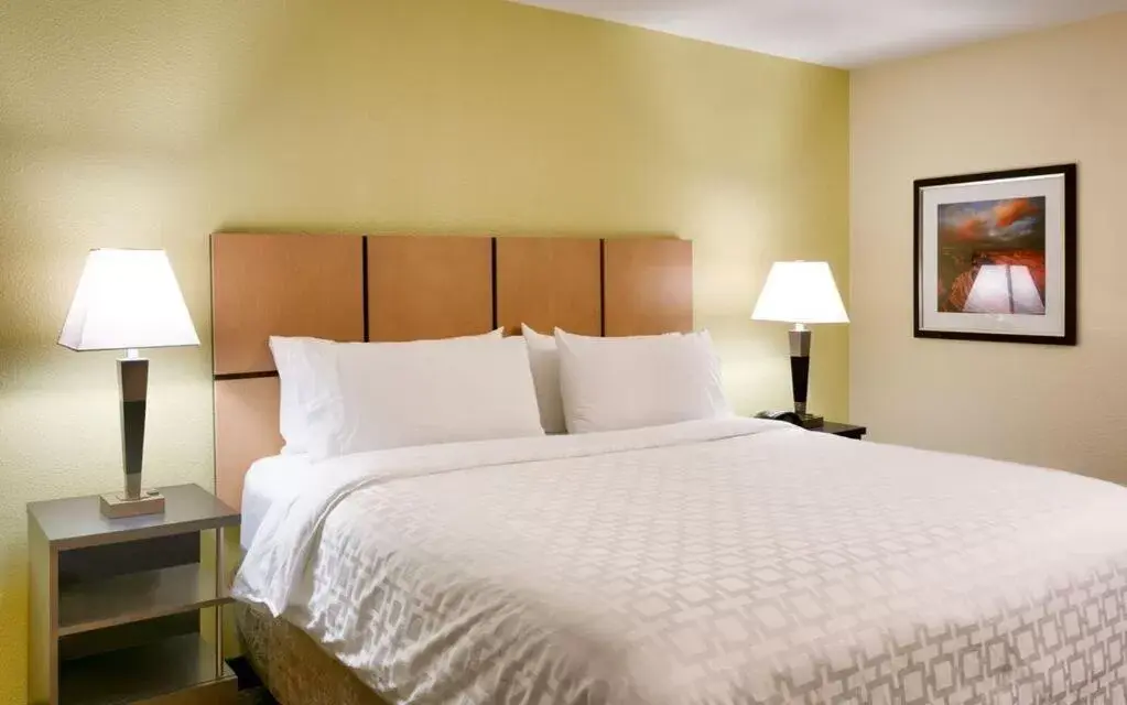 Bed in Candlewood Suites Plano East, an IHG Hotel