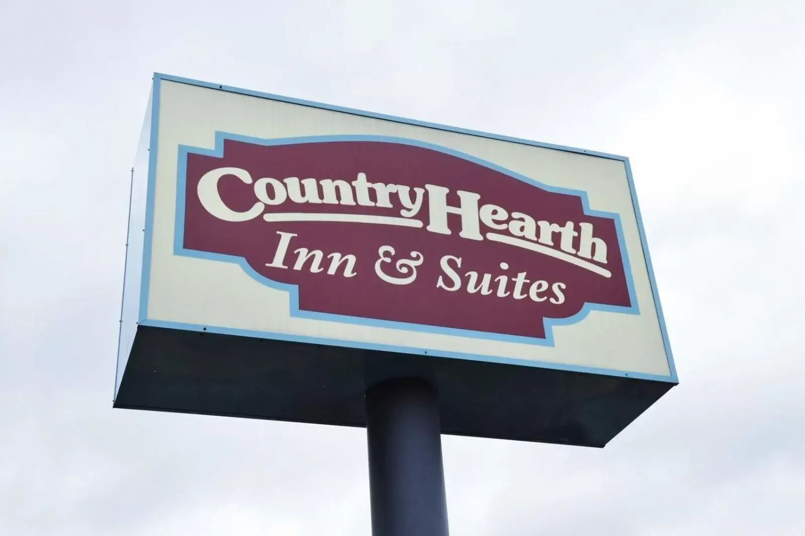 Property logo or sign in Country Hearth Inn & Suites - Kenton