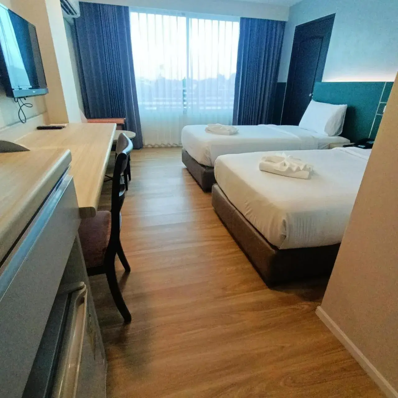 Bed in Mayflower Grande Hotel Phitsanulok